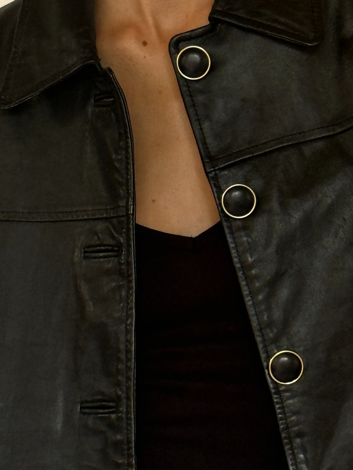 Vintage black leather jacket button detail