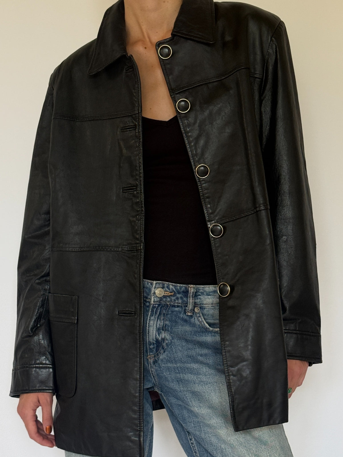 Vintage black leather jacket full front angle