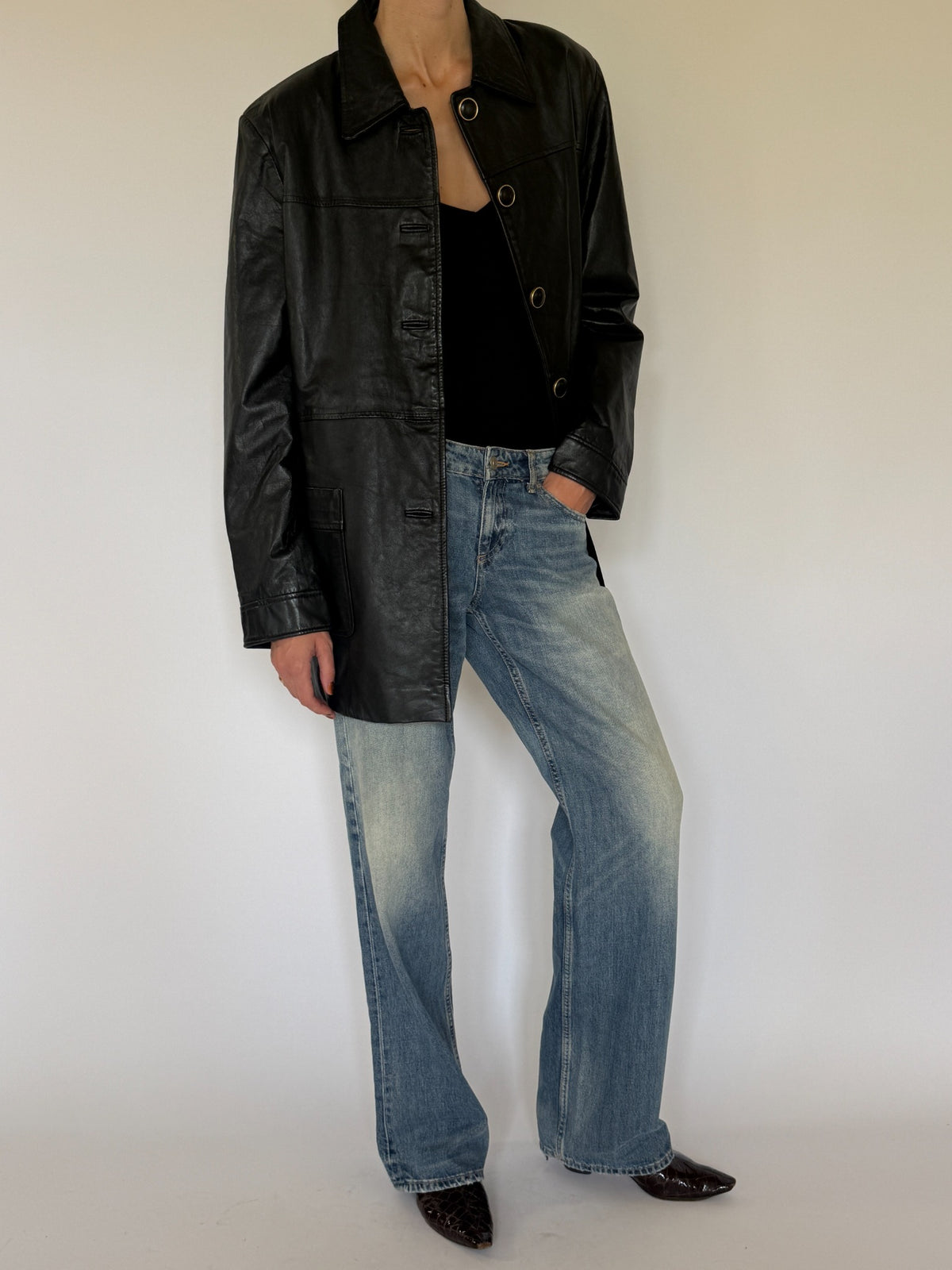 Vintage black leather jacket side view