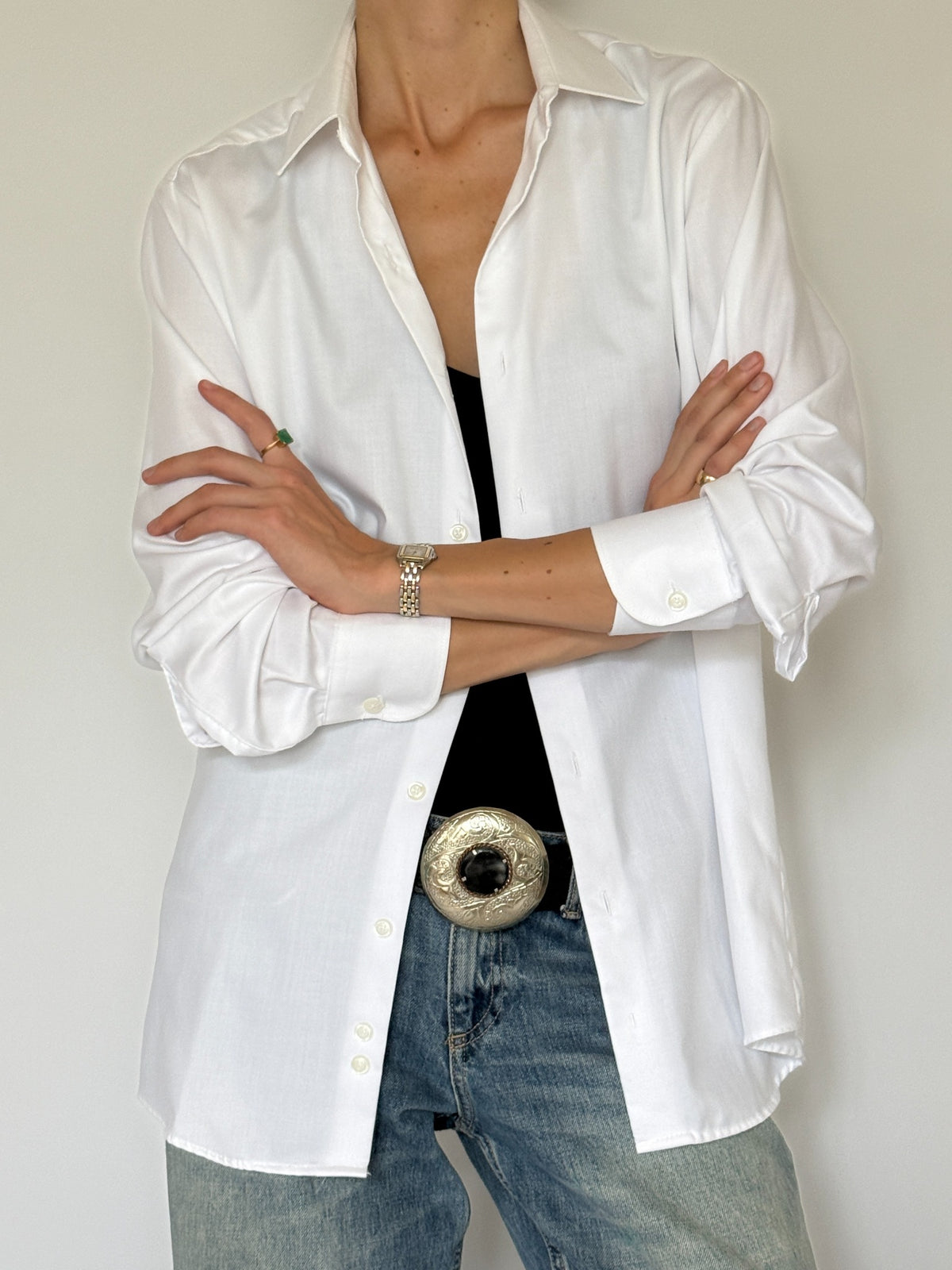 Vintage white button-up shirt cuff and button detail