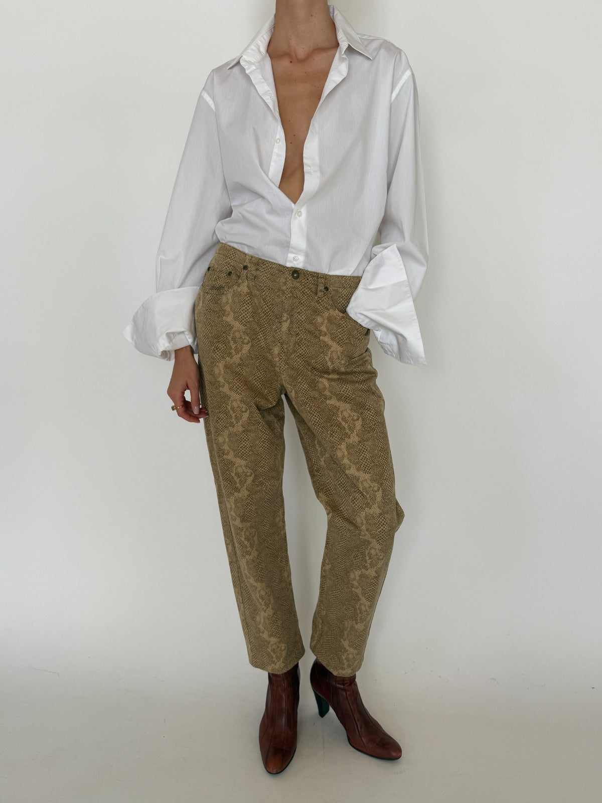 Vintage tan snakeskin print pants modeled full length