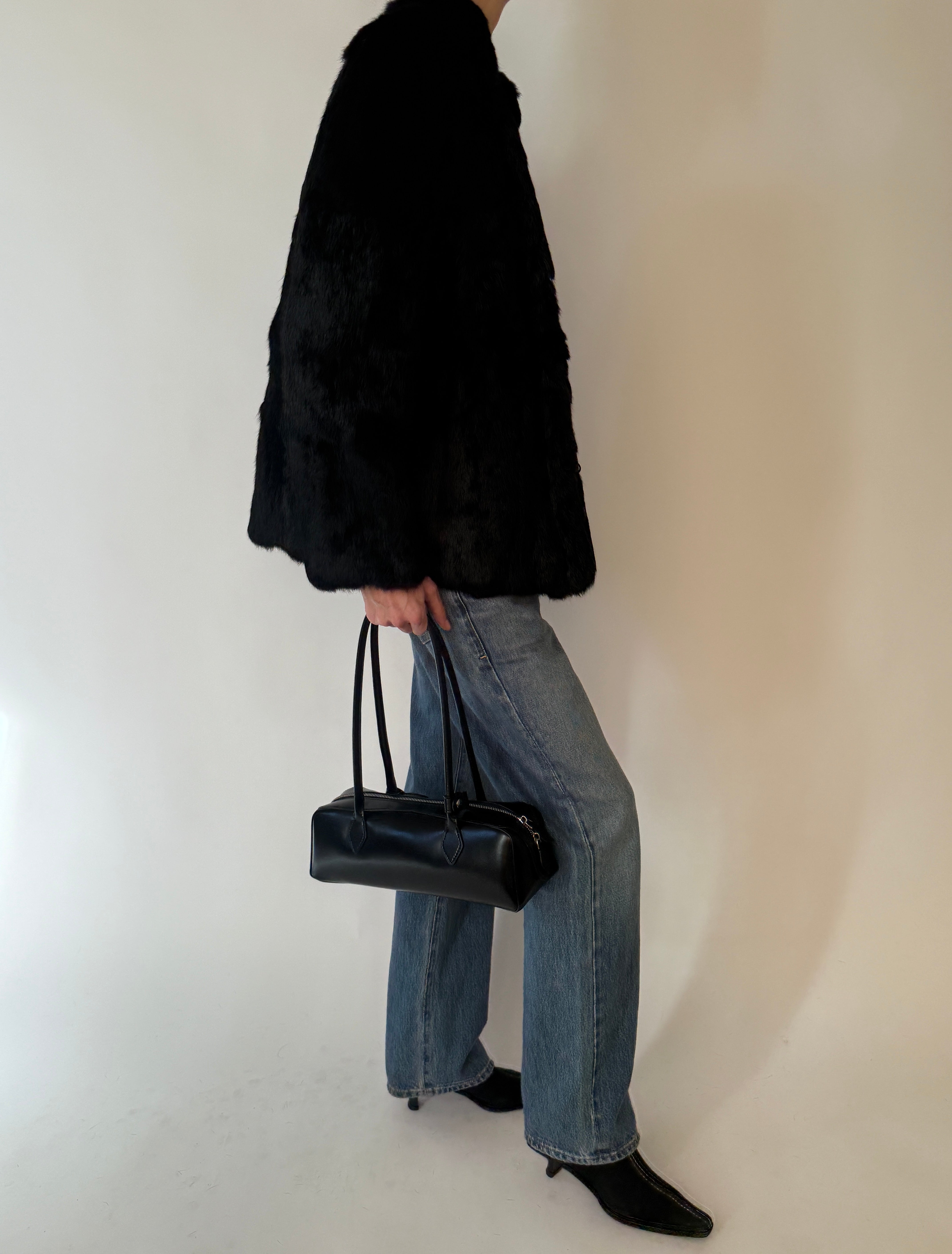 Vintage black fur jacket side profile