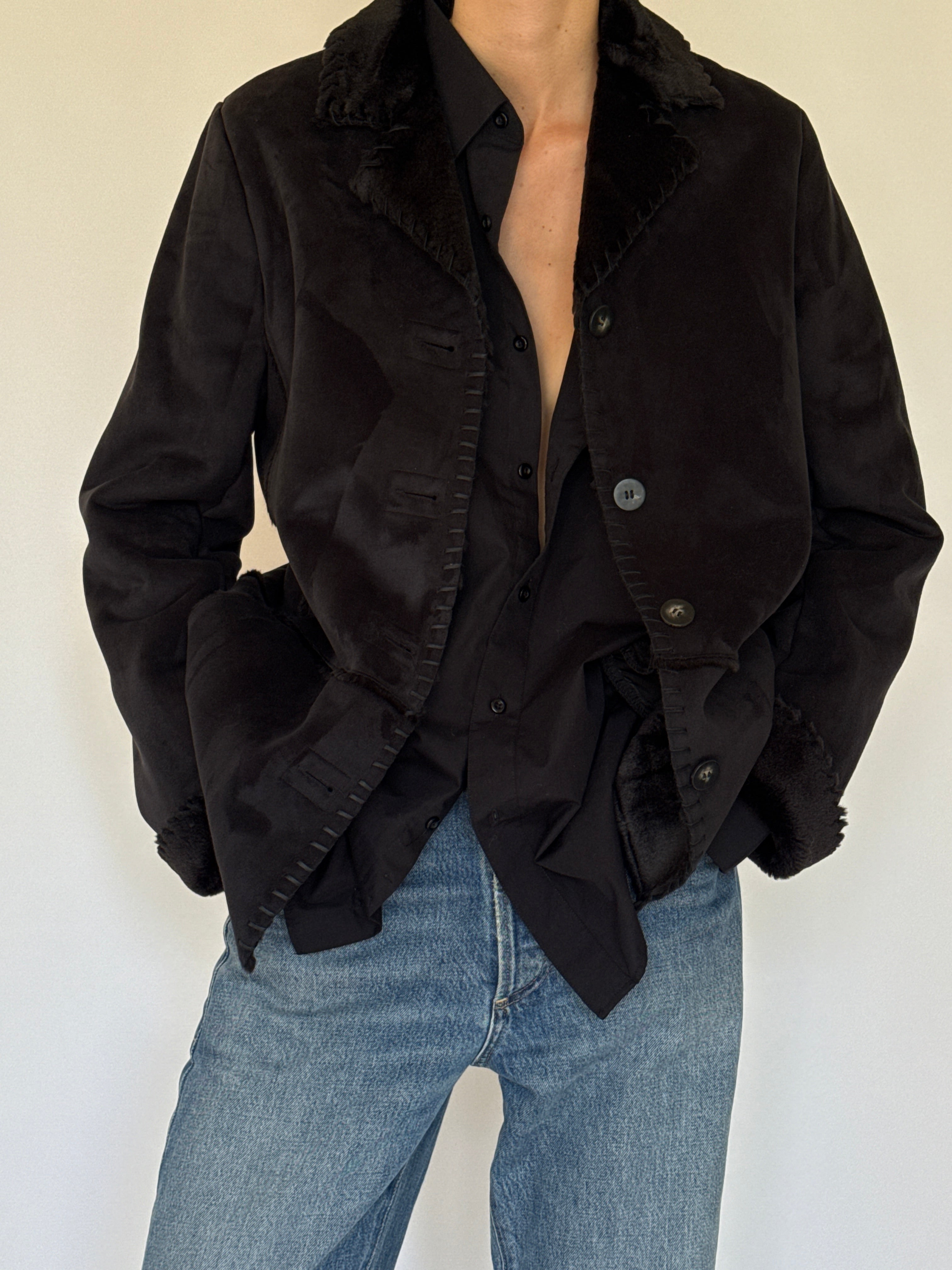 Vintage black shearling trim jacket fabric close-up suede texture
