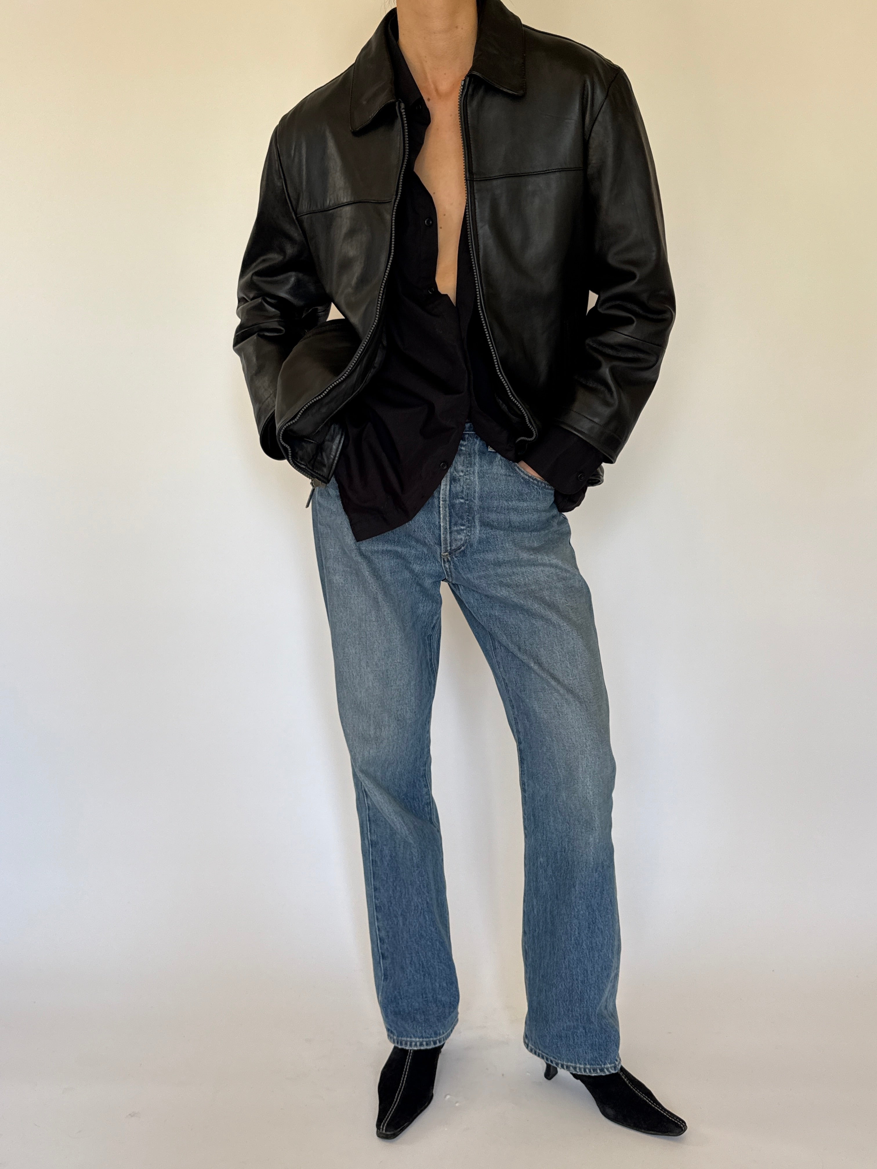 Vintage black leather jacket structured silhouette