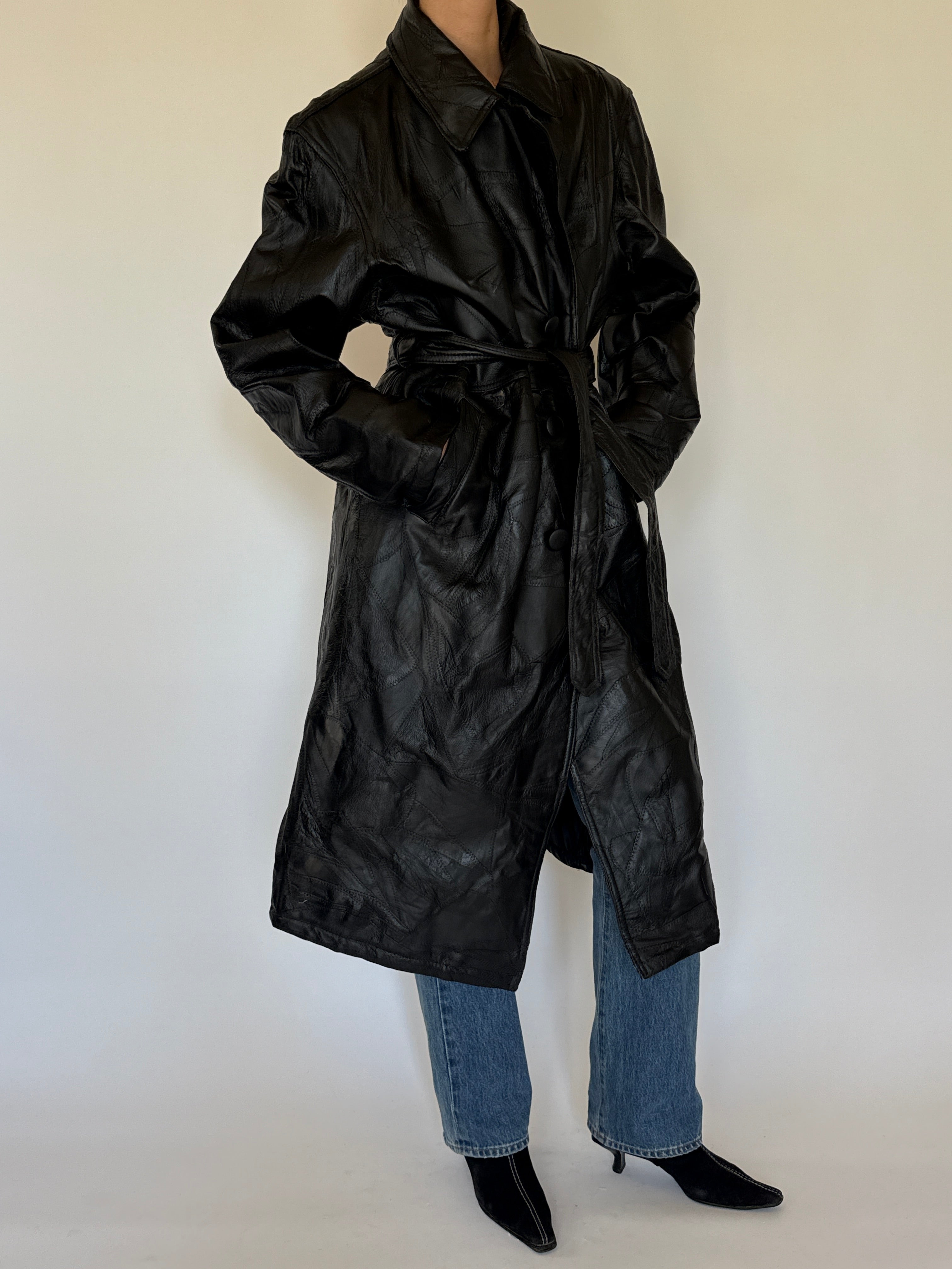 Vintage black leather trench coat full-length view