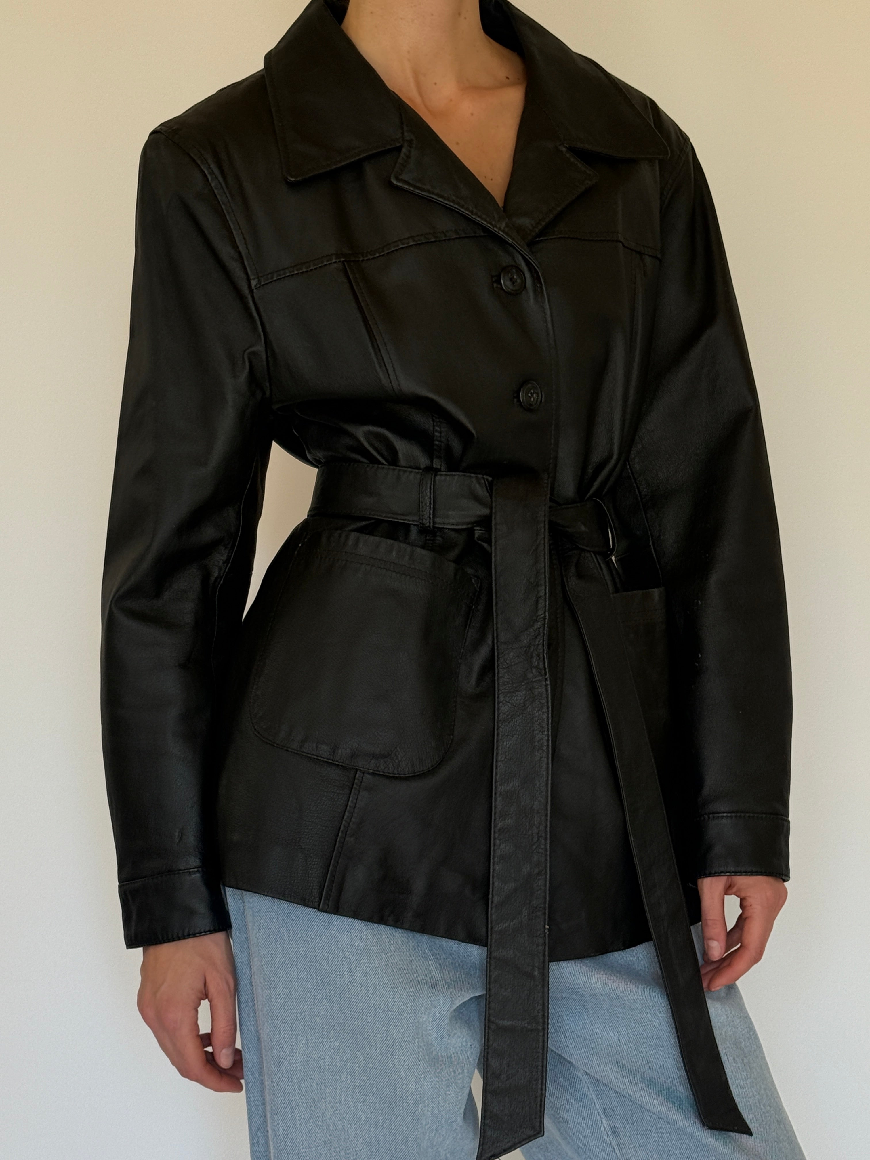 Vintage black leather jacket side view cinched waist