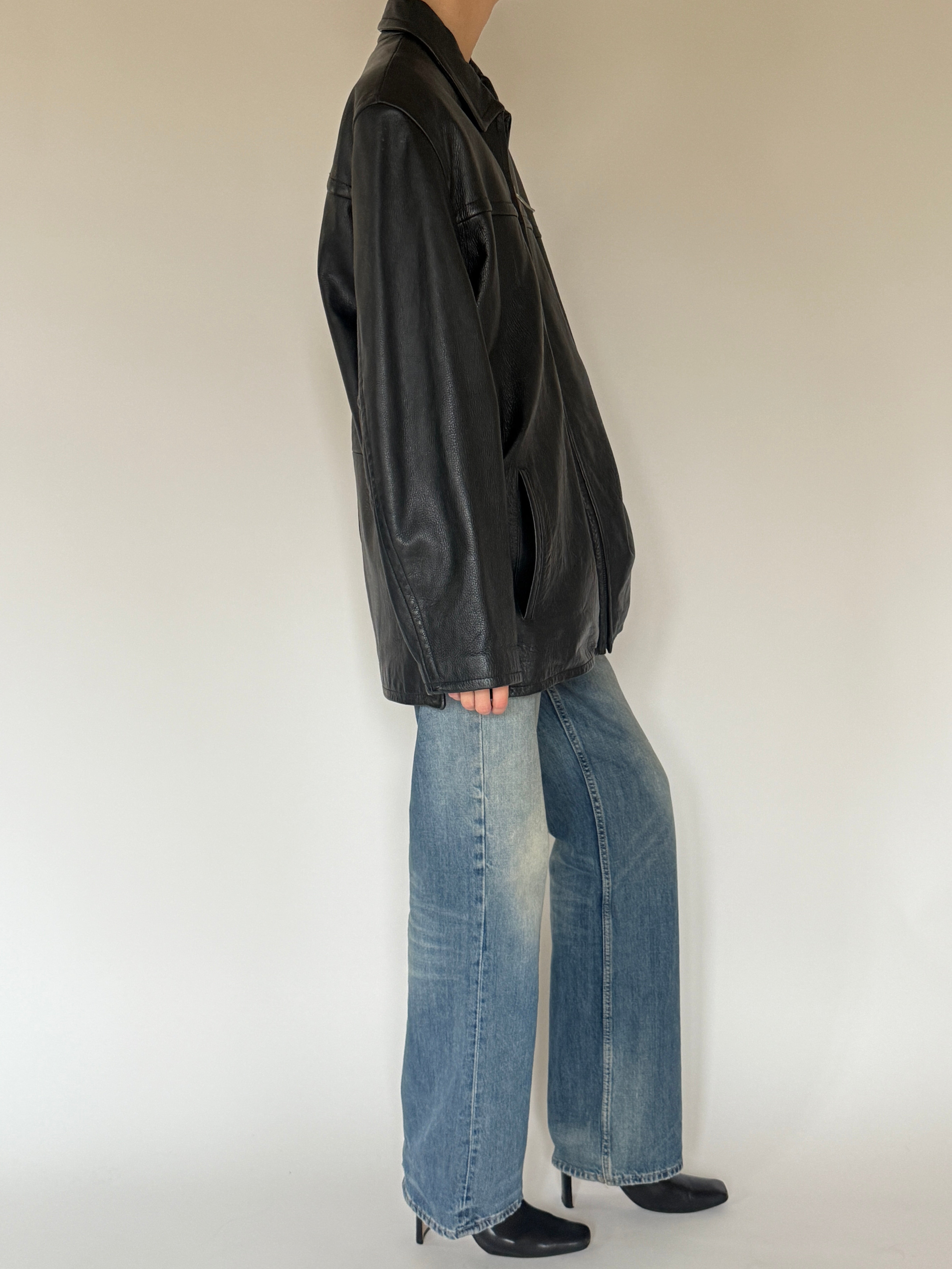 Vintage oversized black leather jacket side view