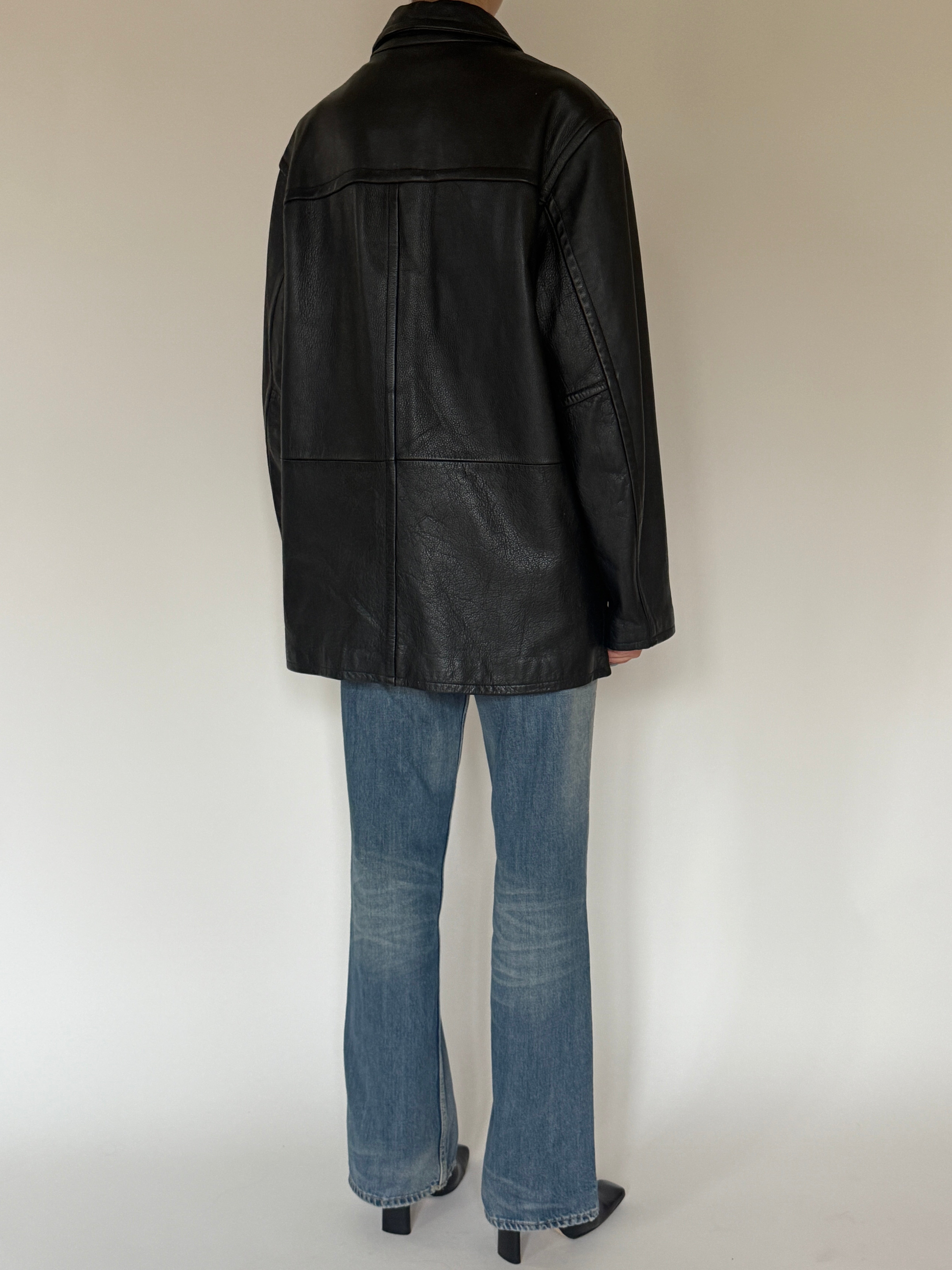 Vintage oversized black leather jacket back view