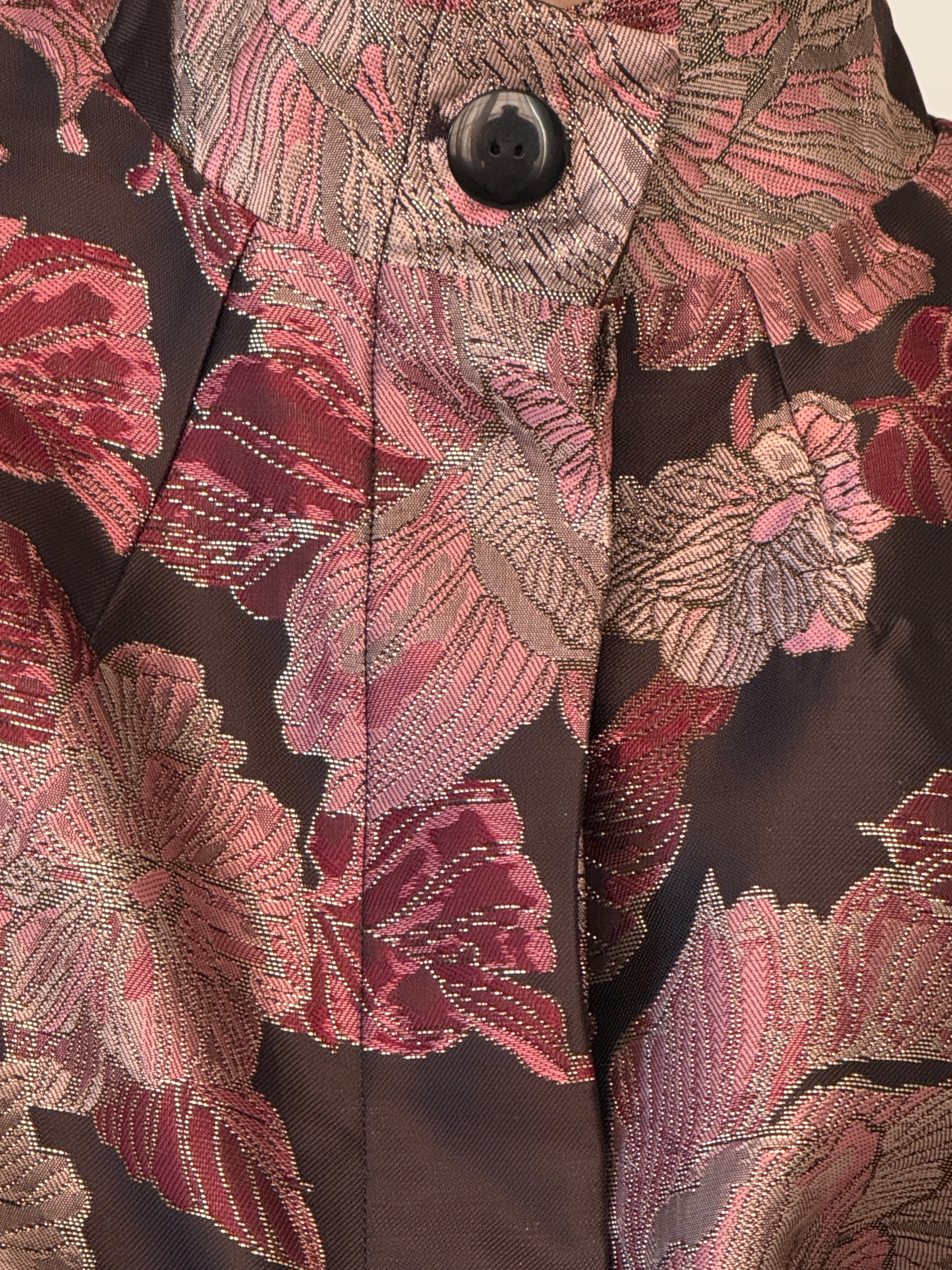 Close-up of floral brocade fabric on vintage jacket