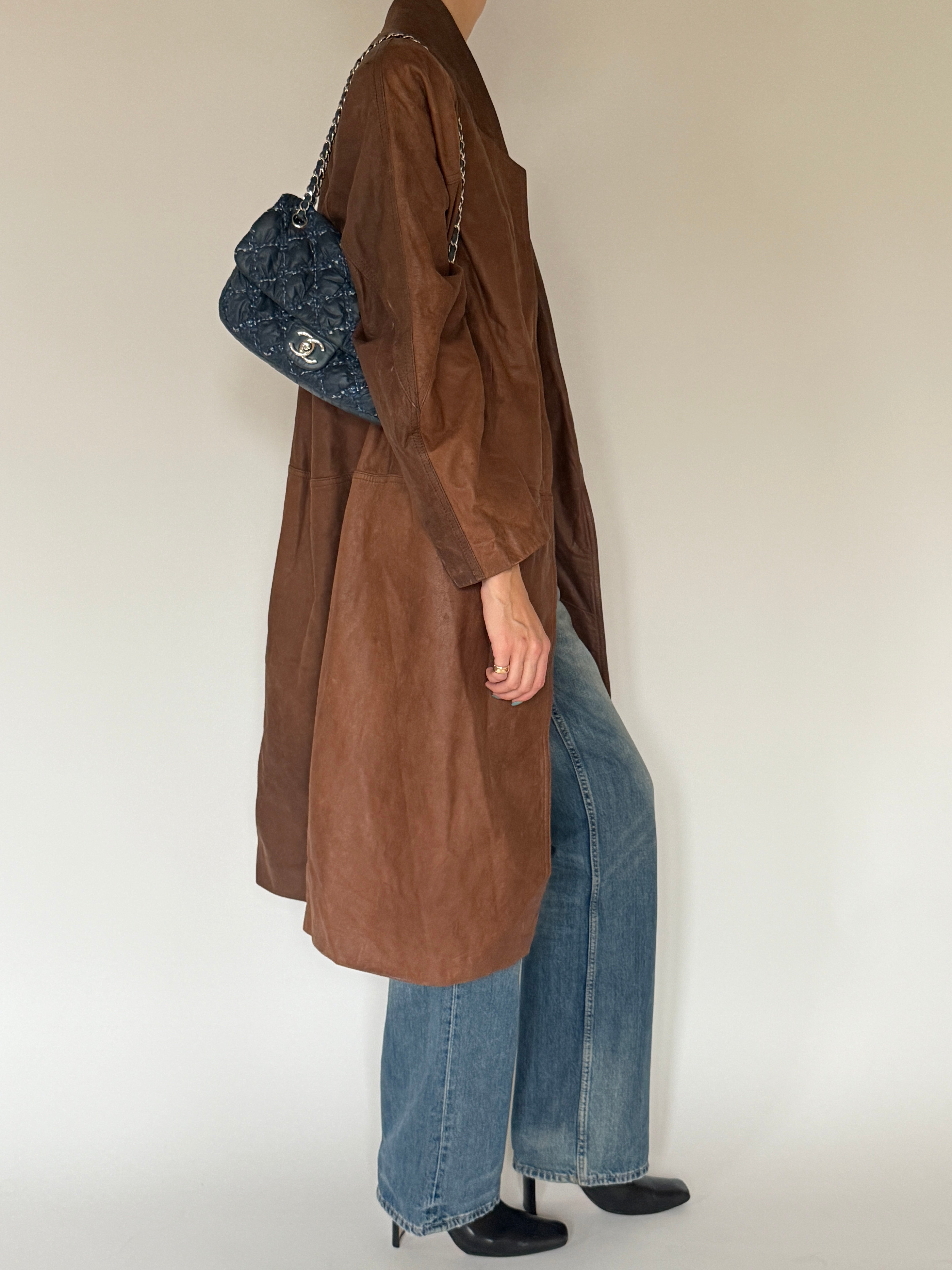 Vintage brown leather coat side view