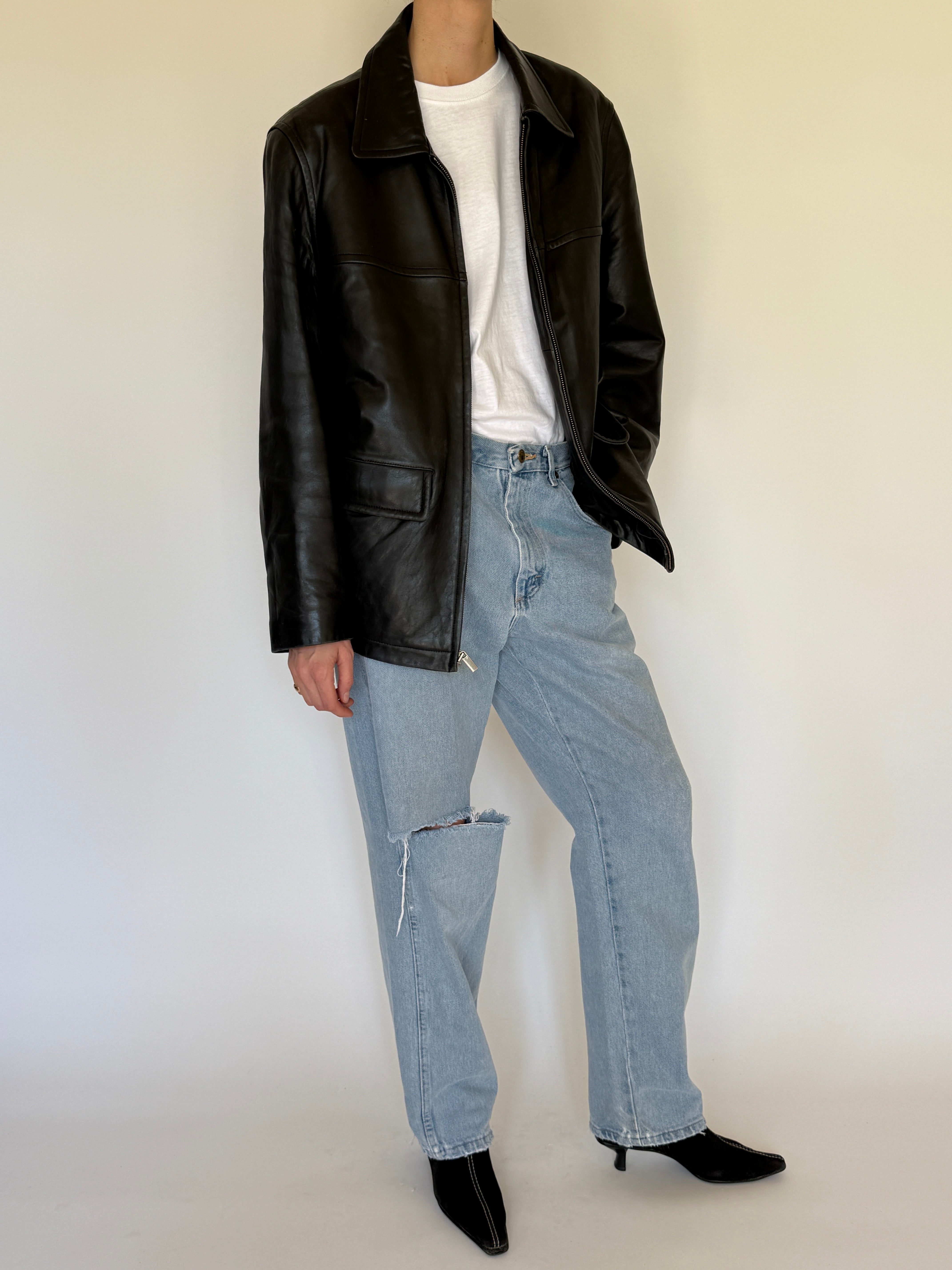 Vintage black leather jacket collar detail