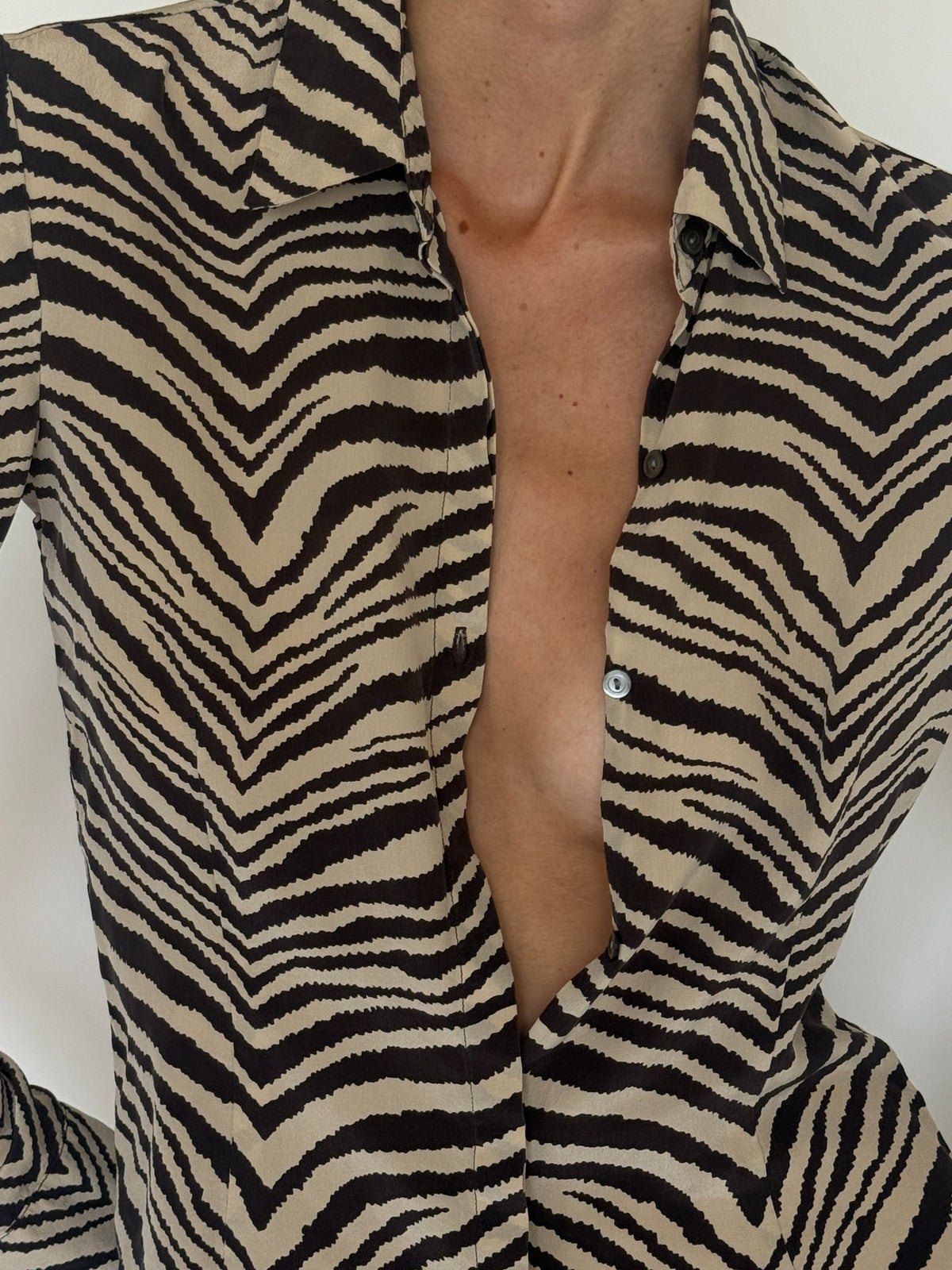 Vintage zebra print silk shirt pattern close-up