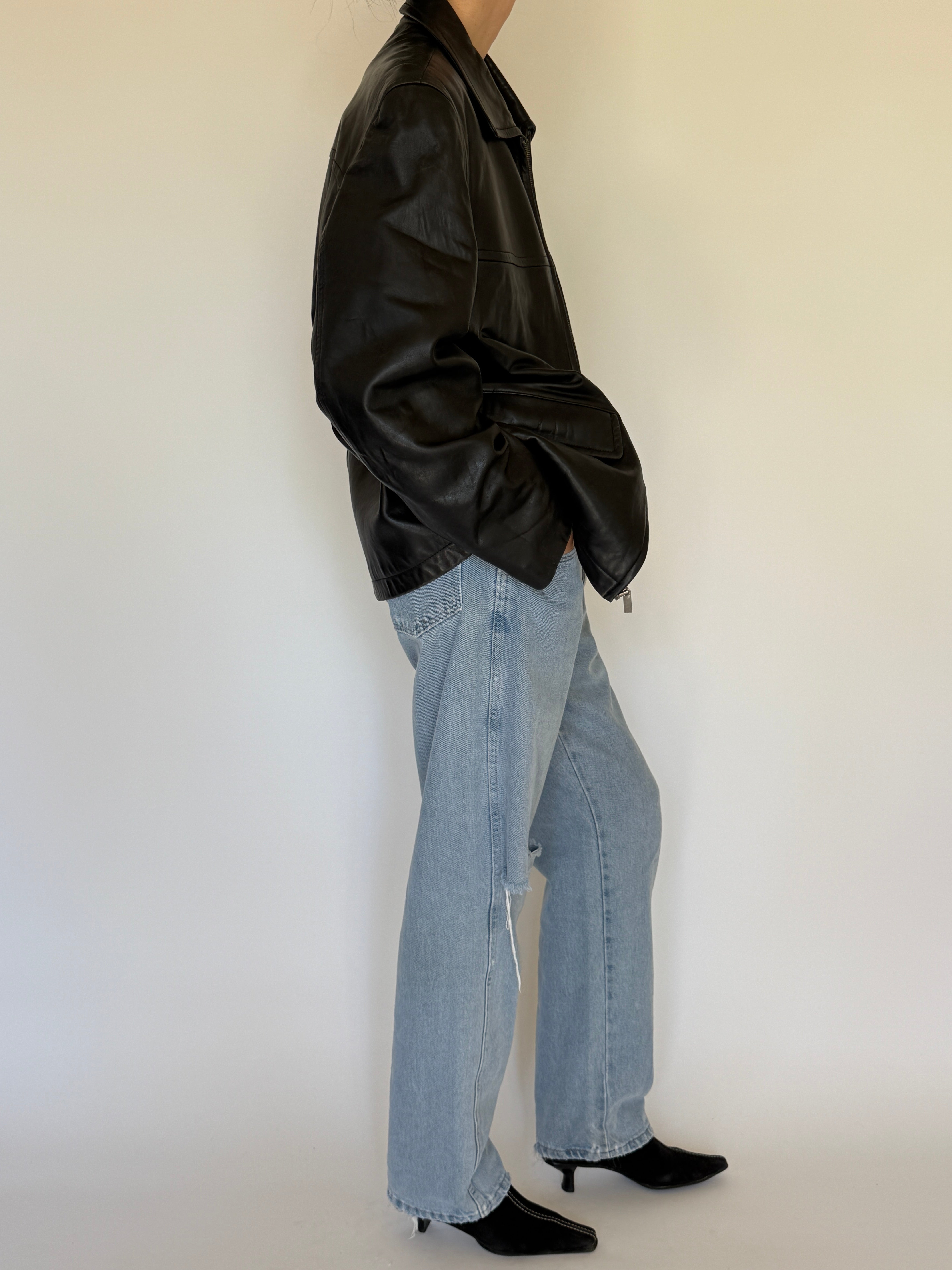 Vintage black leather jacket side view