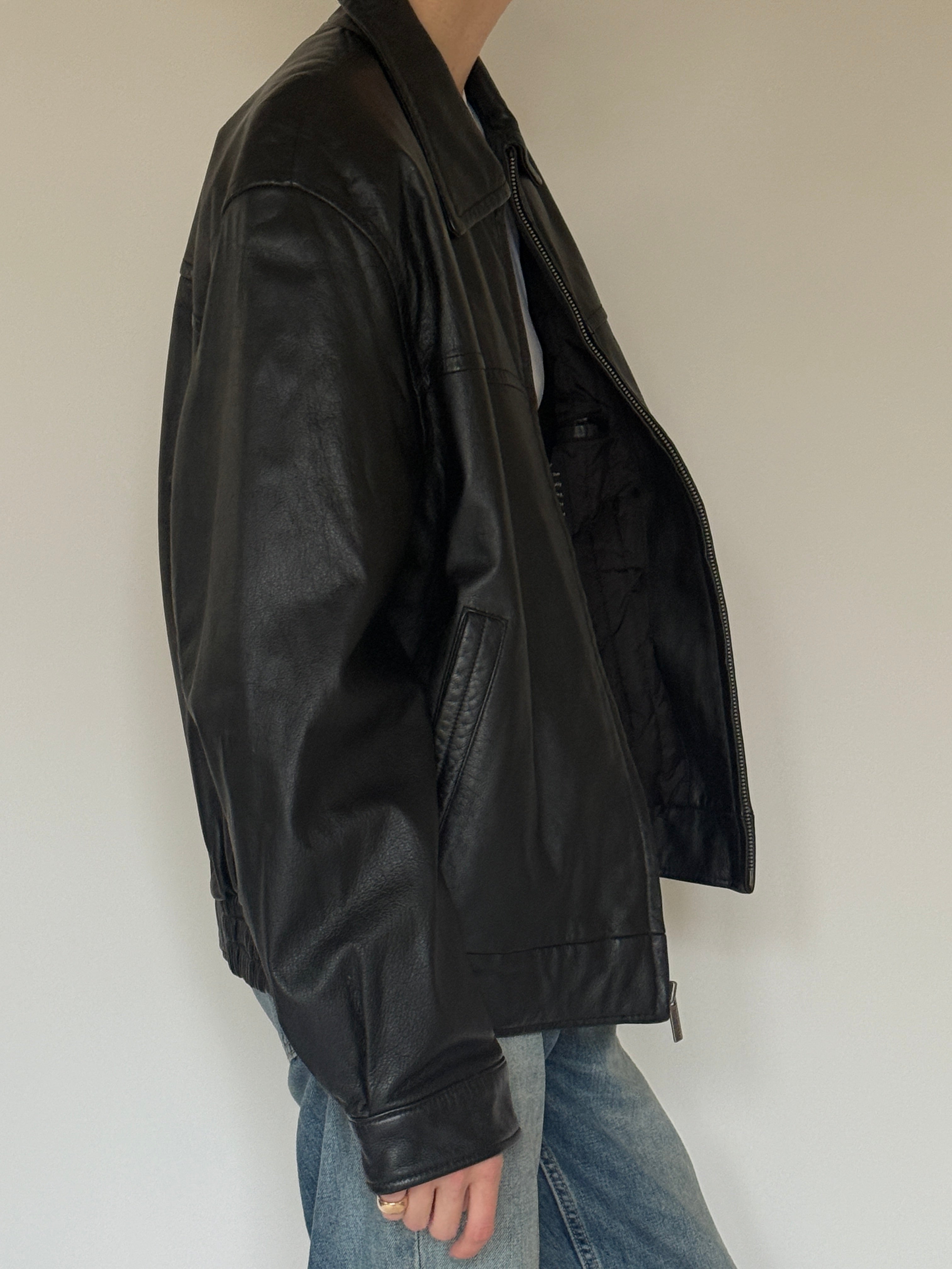 Vintage black leather jacket side view