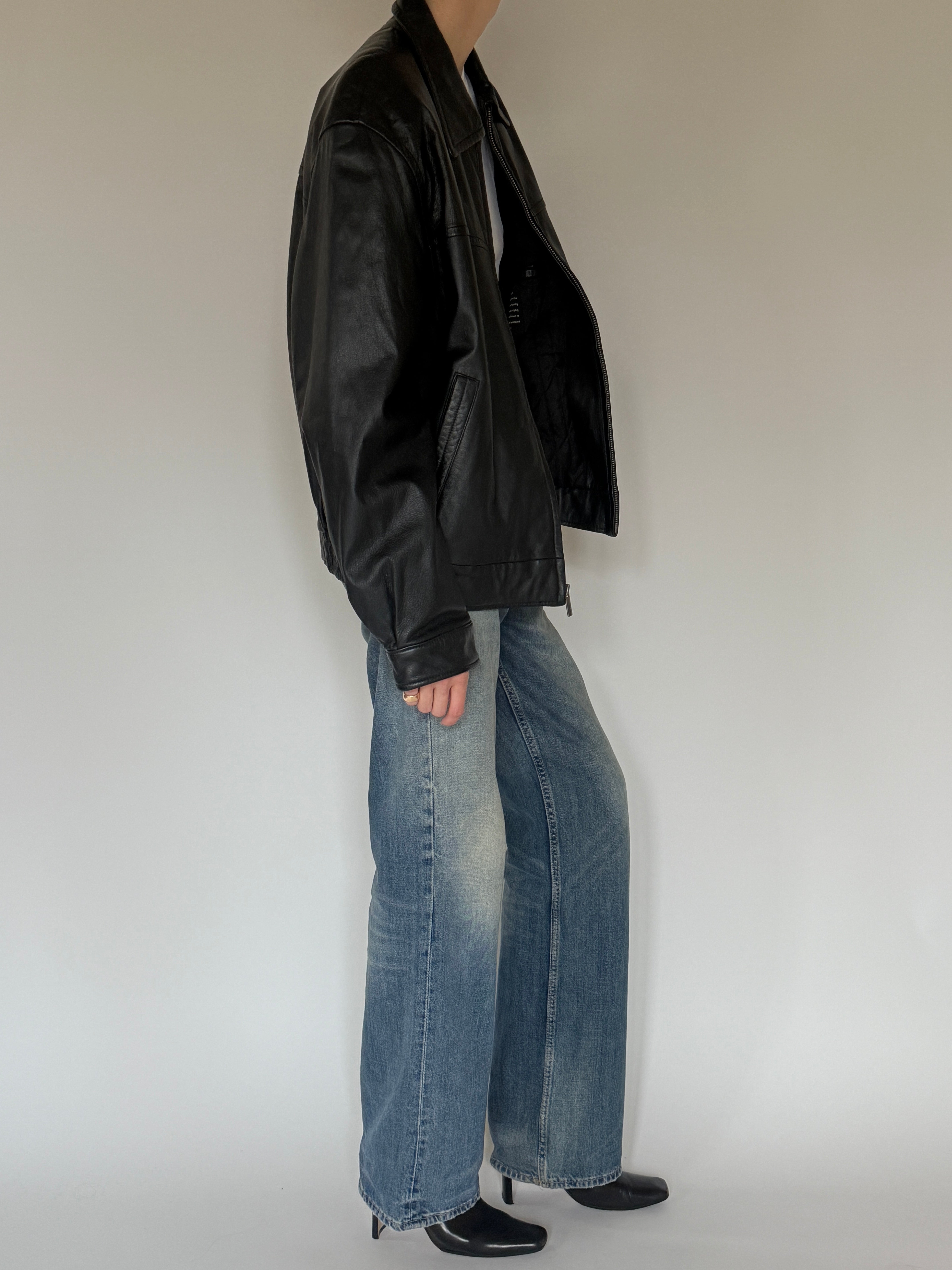 Vintage black leather jacket side view