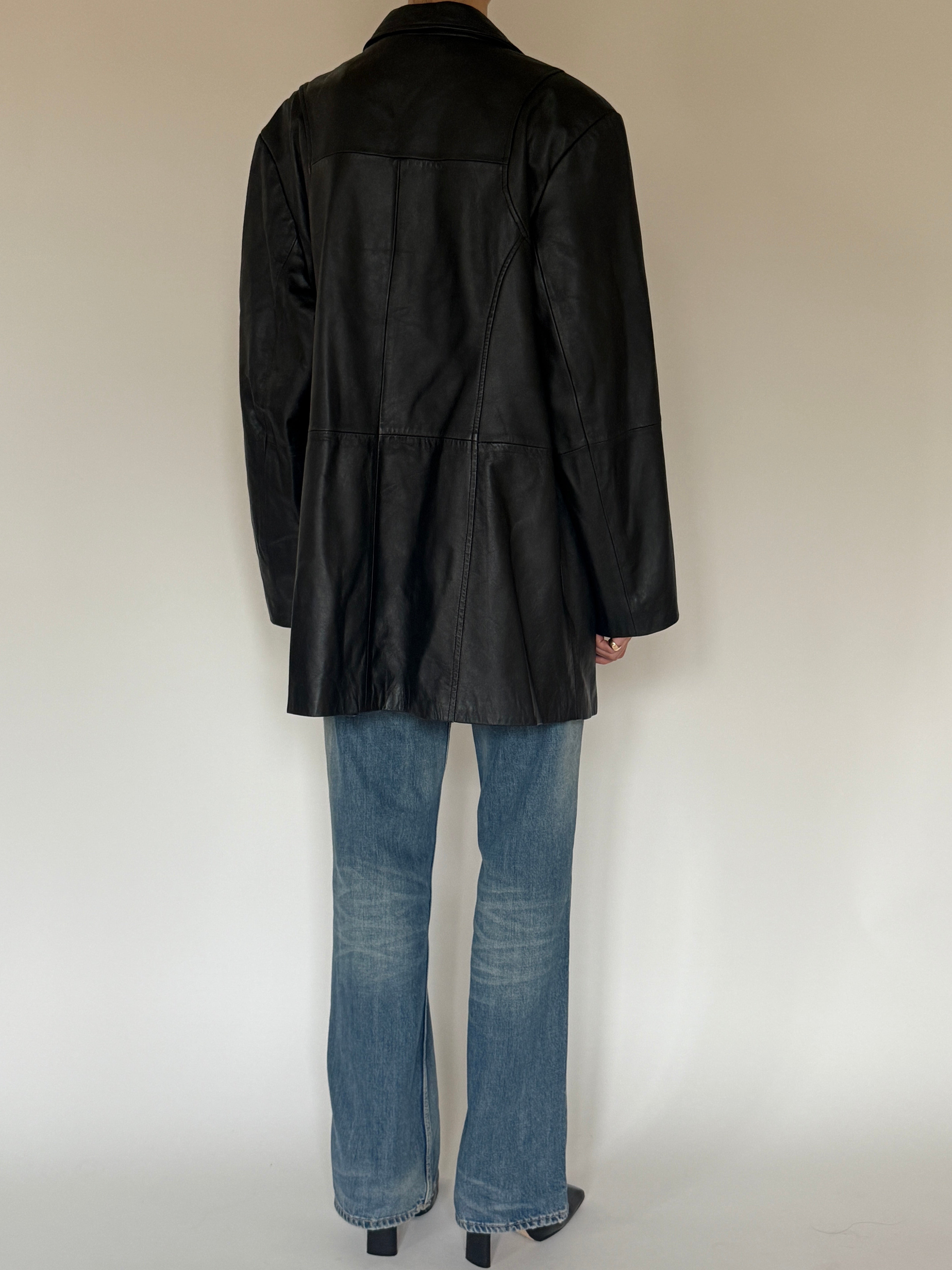 Vintage black leather jacket back view
