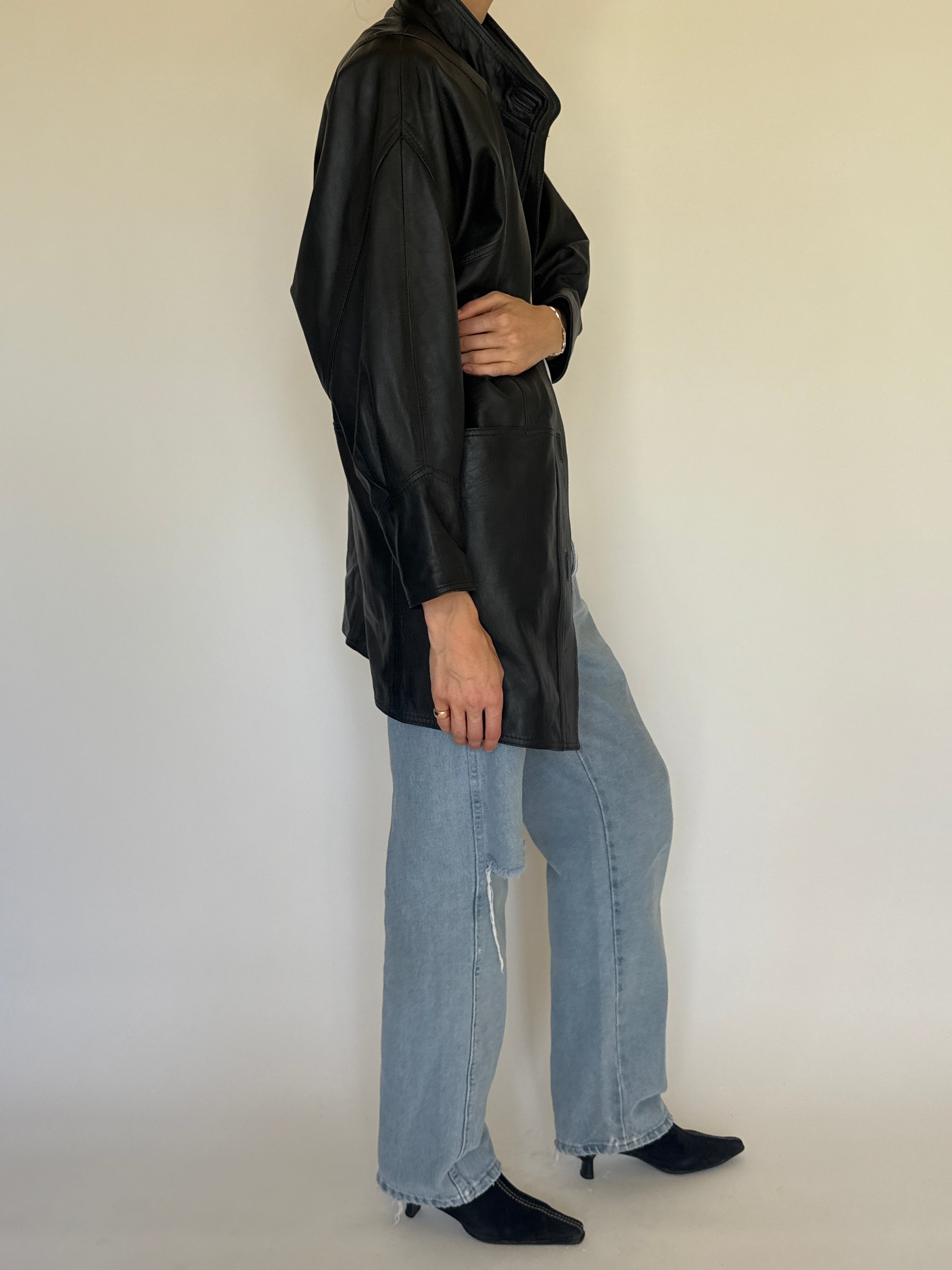 Vintage black leather jacket oversized silhouette side view