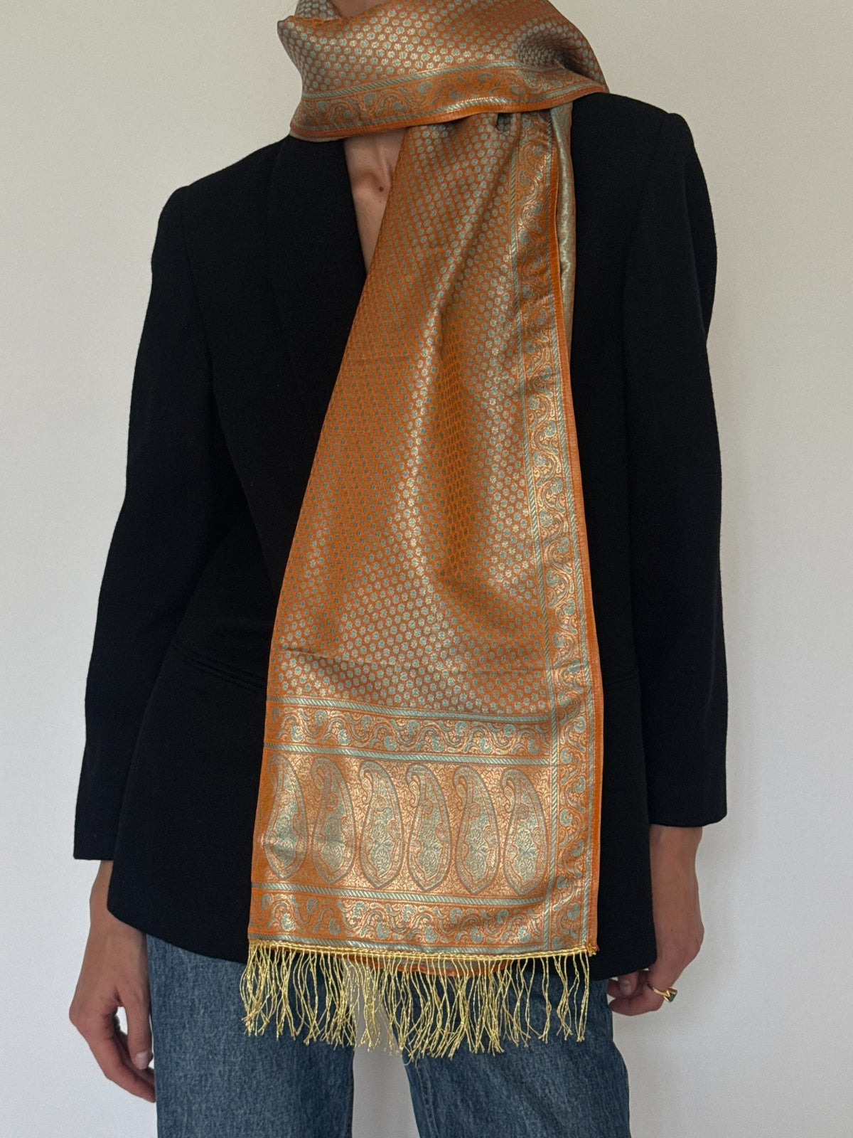 Vintage paisley scarf styled front view in burnt orange and aqua
