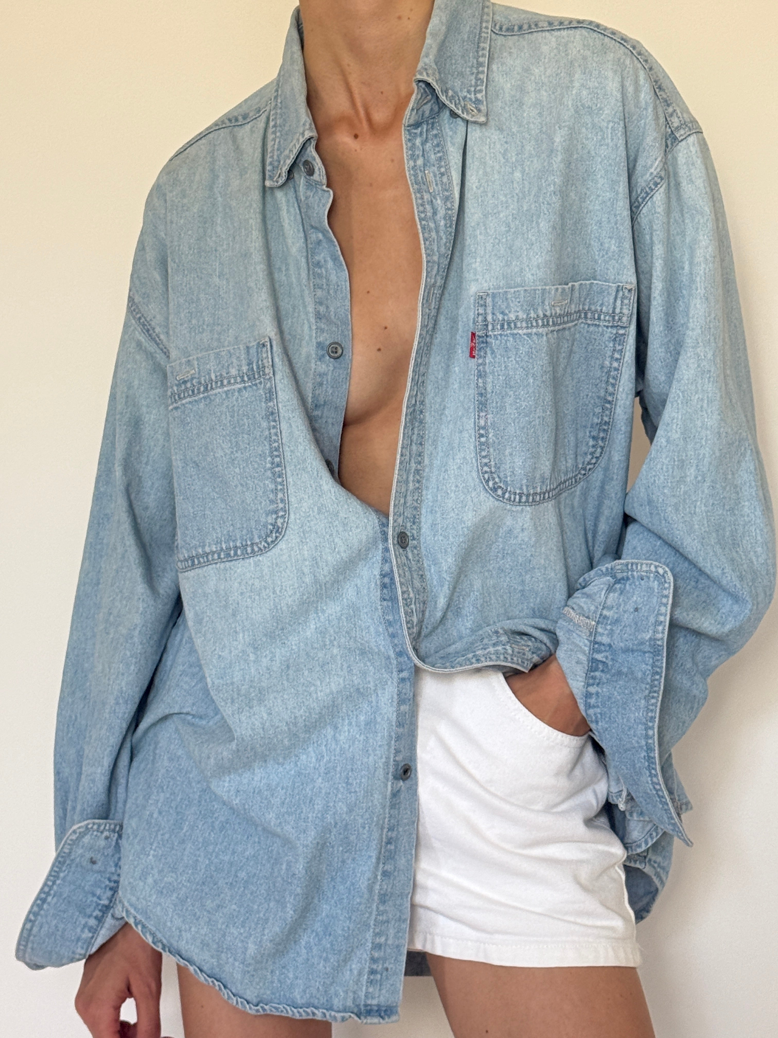 Vintage light wash denim fabric close-up
