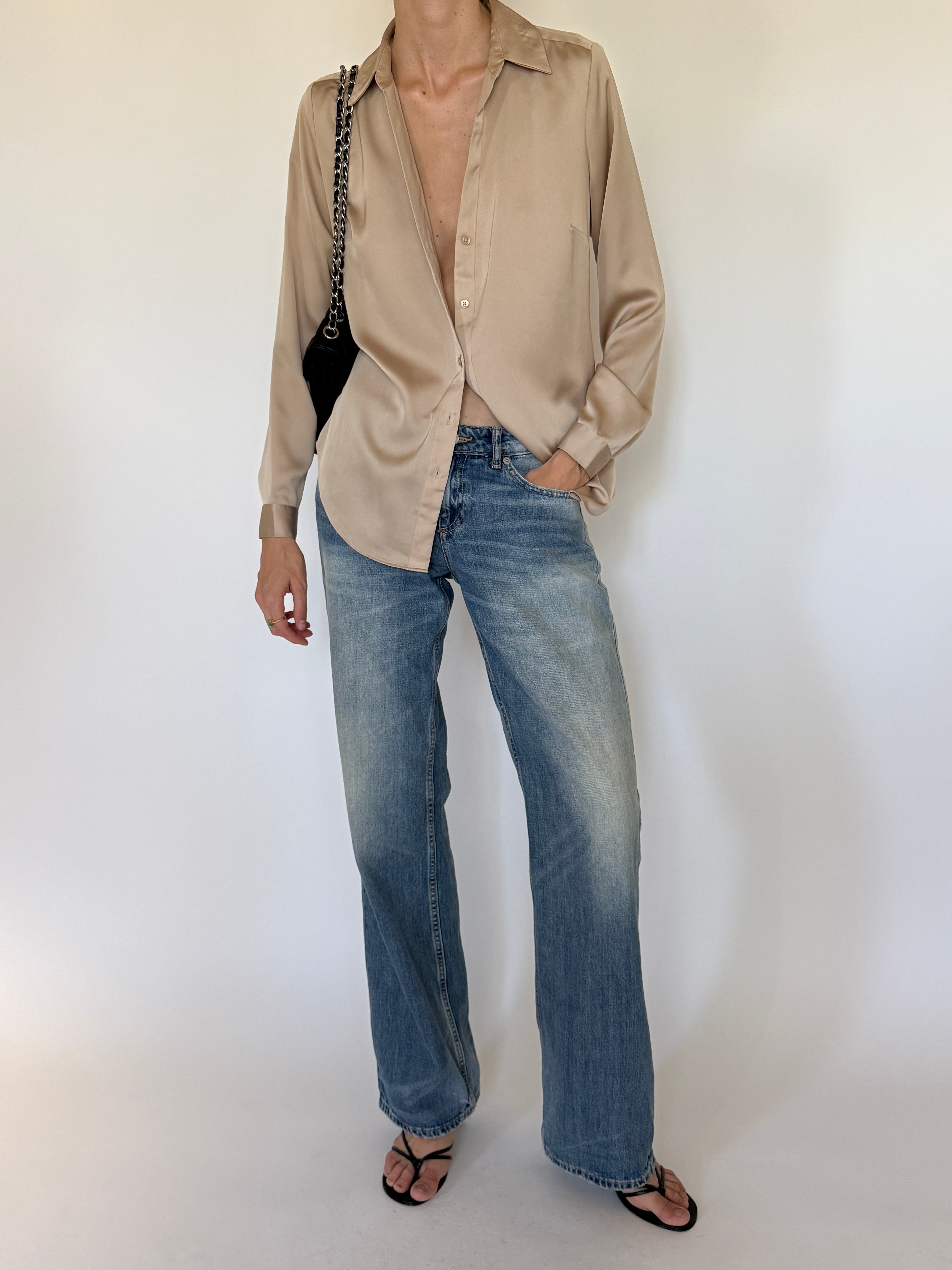 Vintage champagne button-up shirt front view.