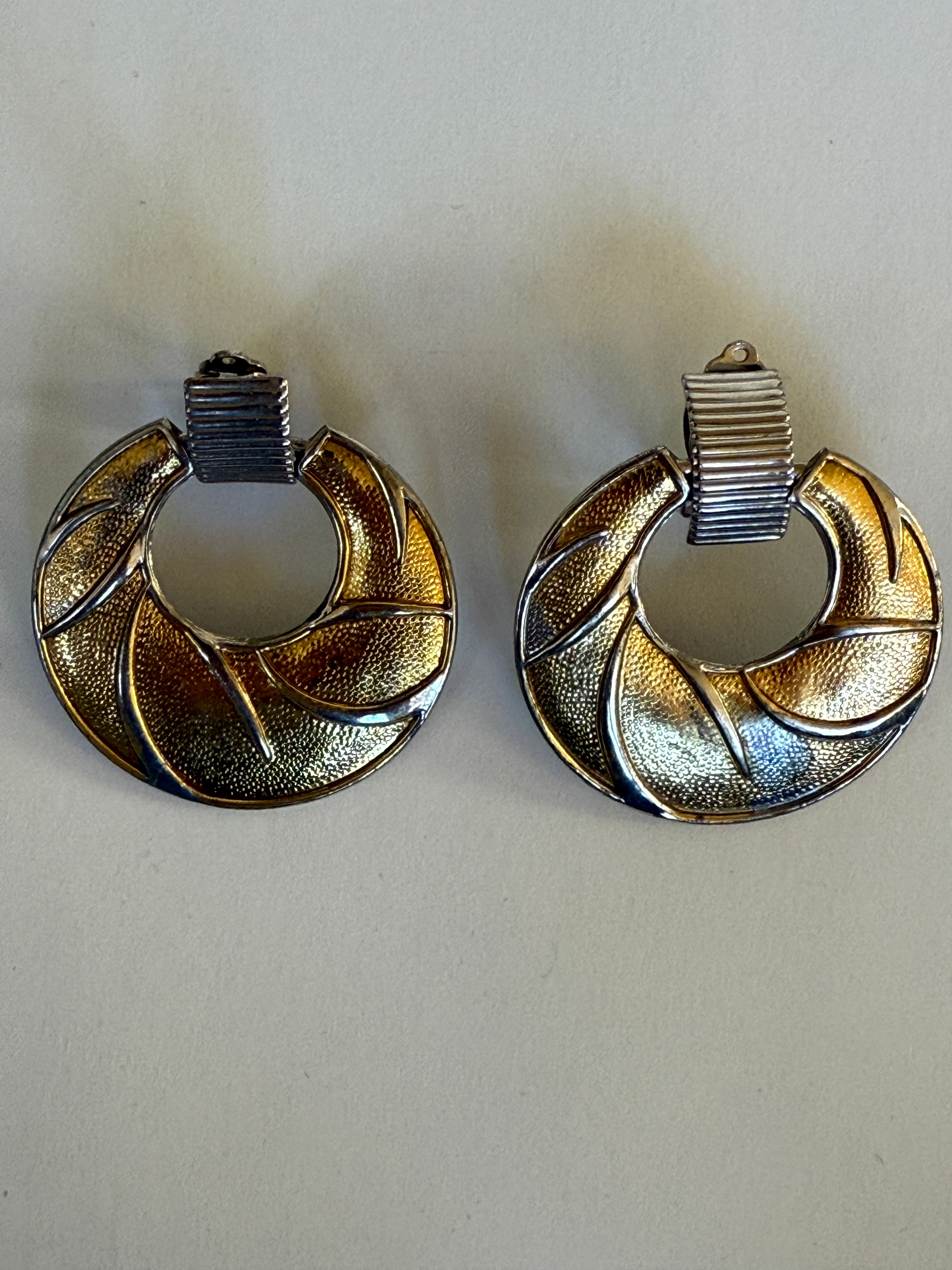 Vintage two-tone gold and silver swirl clip-on earrings circular design detail