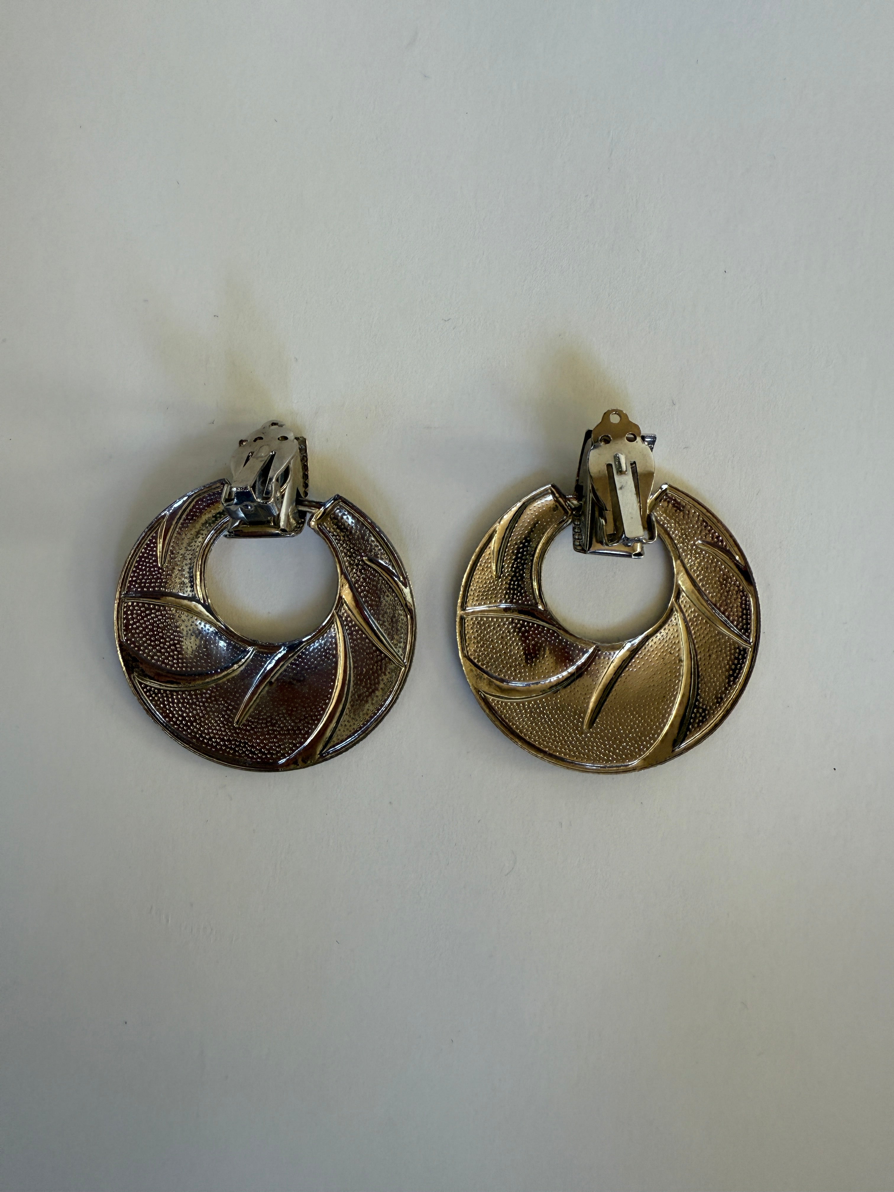 Vintage two-tone gold and silver swirl clip-on earrings back clip detail