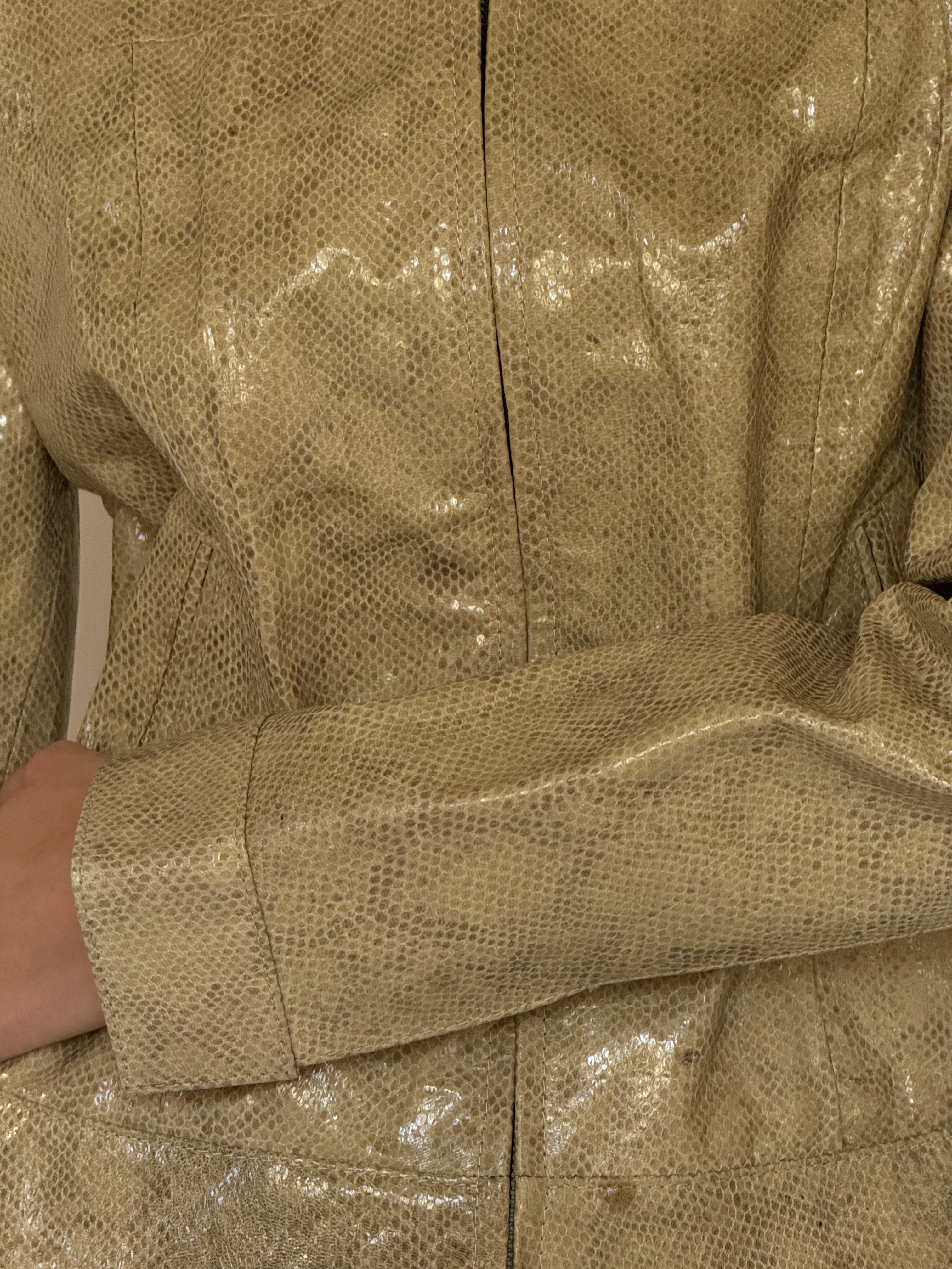 Vintage olive snake embossed leather texture close-up