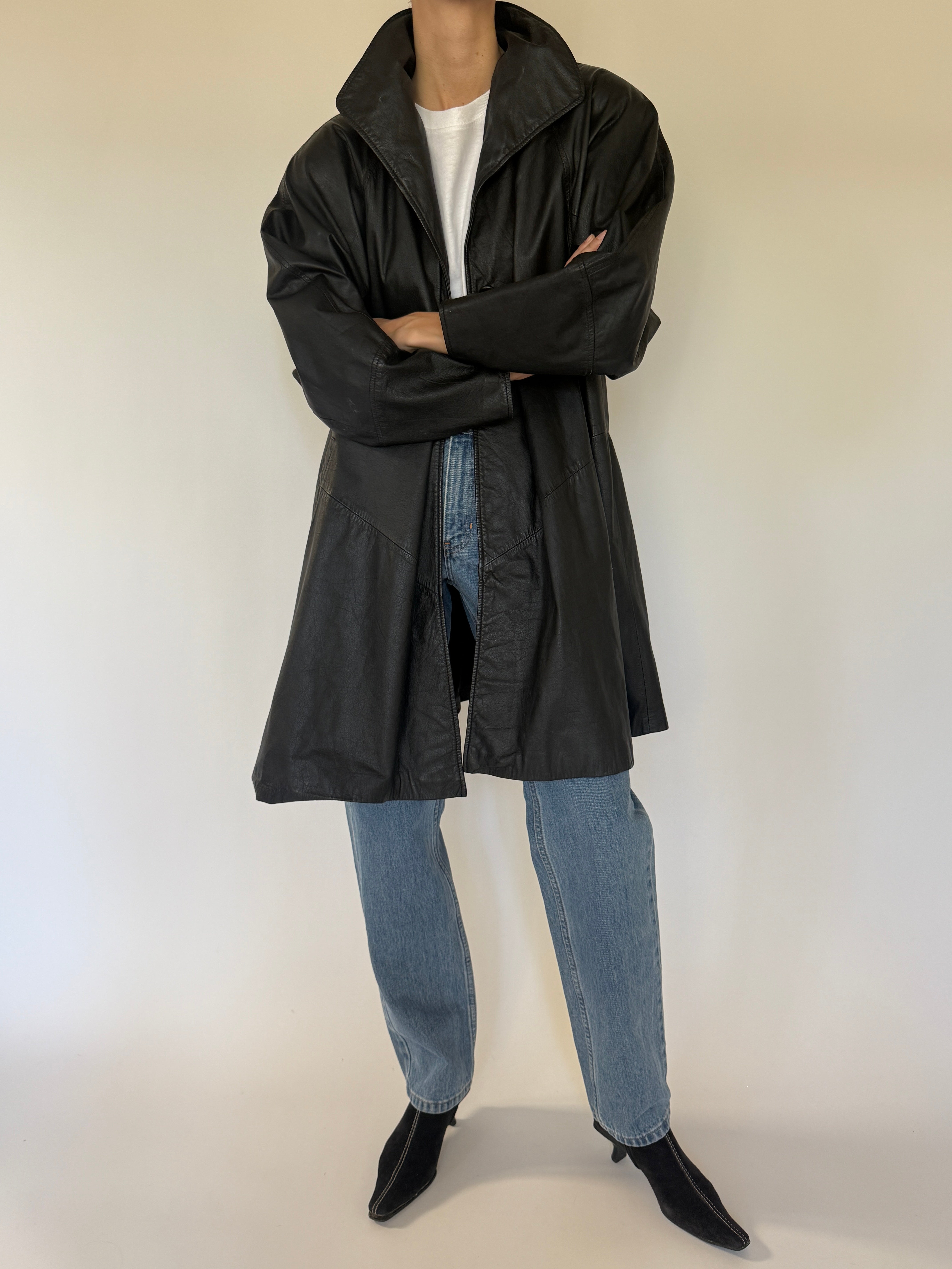 Vintage black leather coat button detail