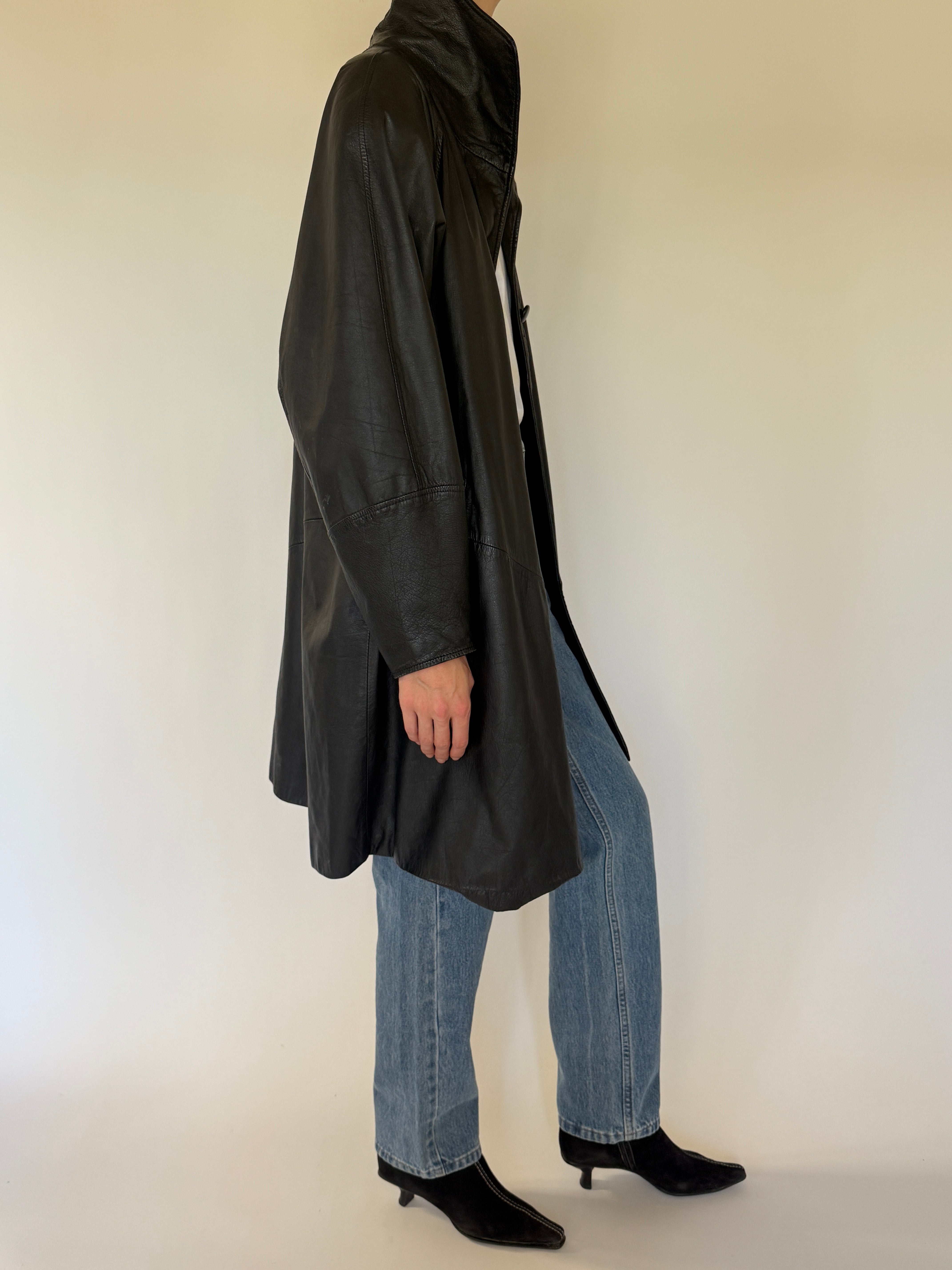 Vintage black leather coat side view