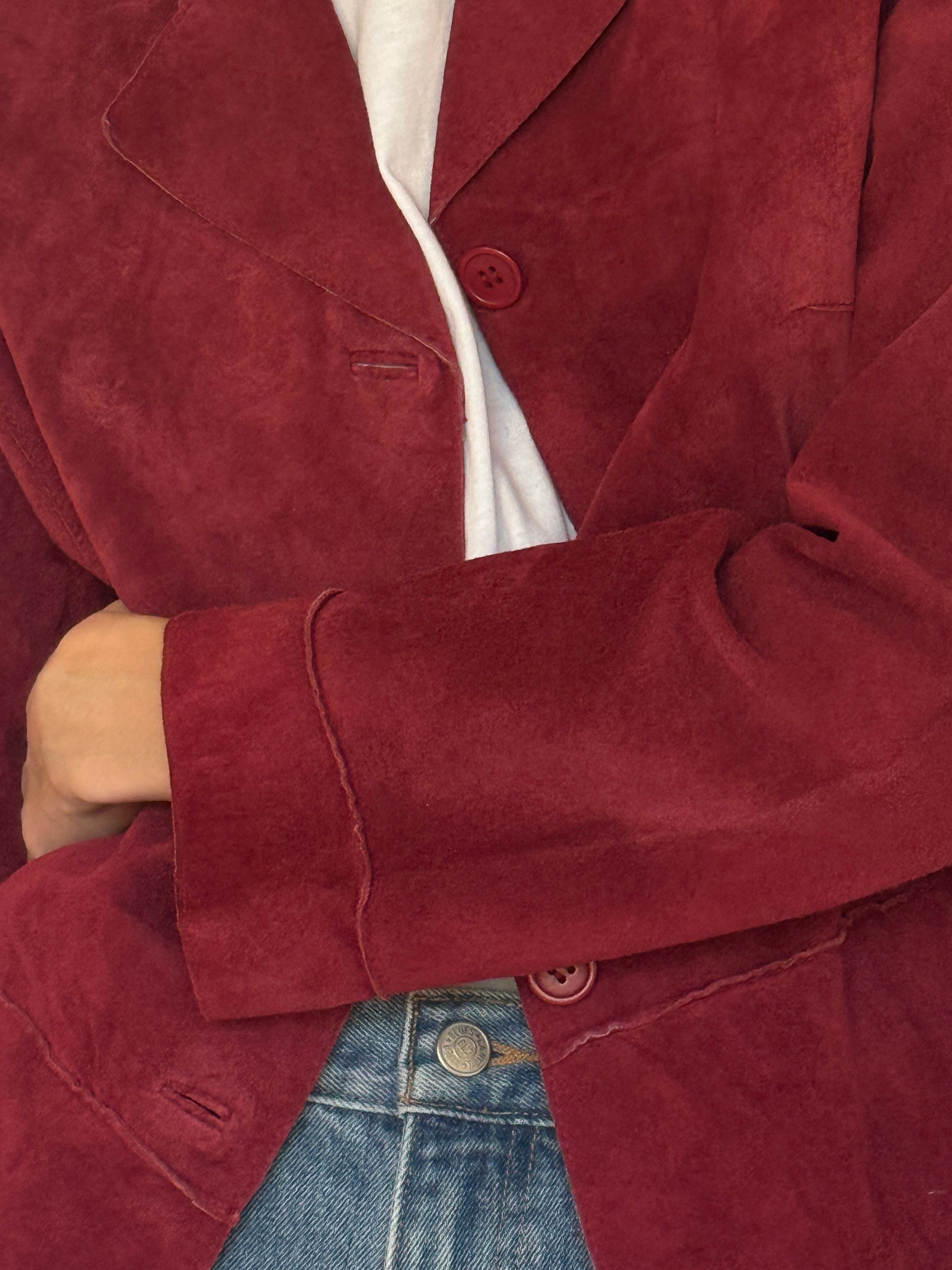 Vintage red suede leather jacket texture close-up