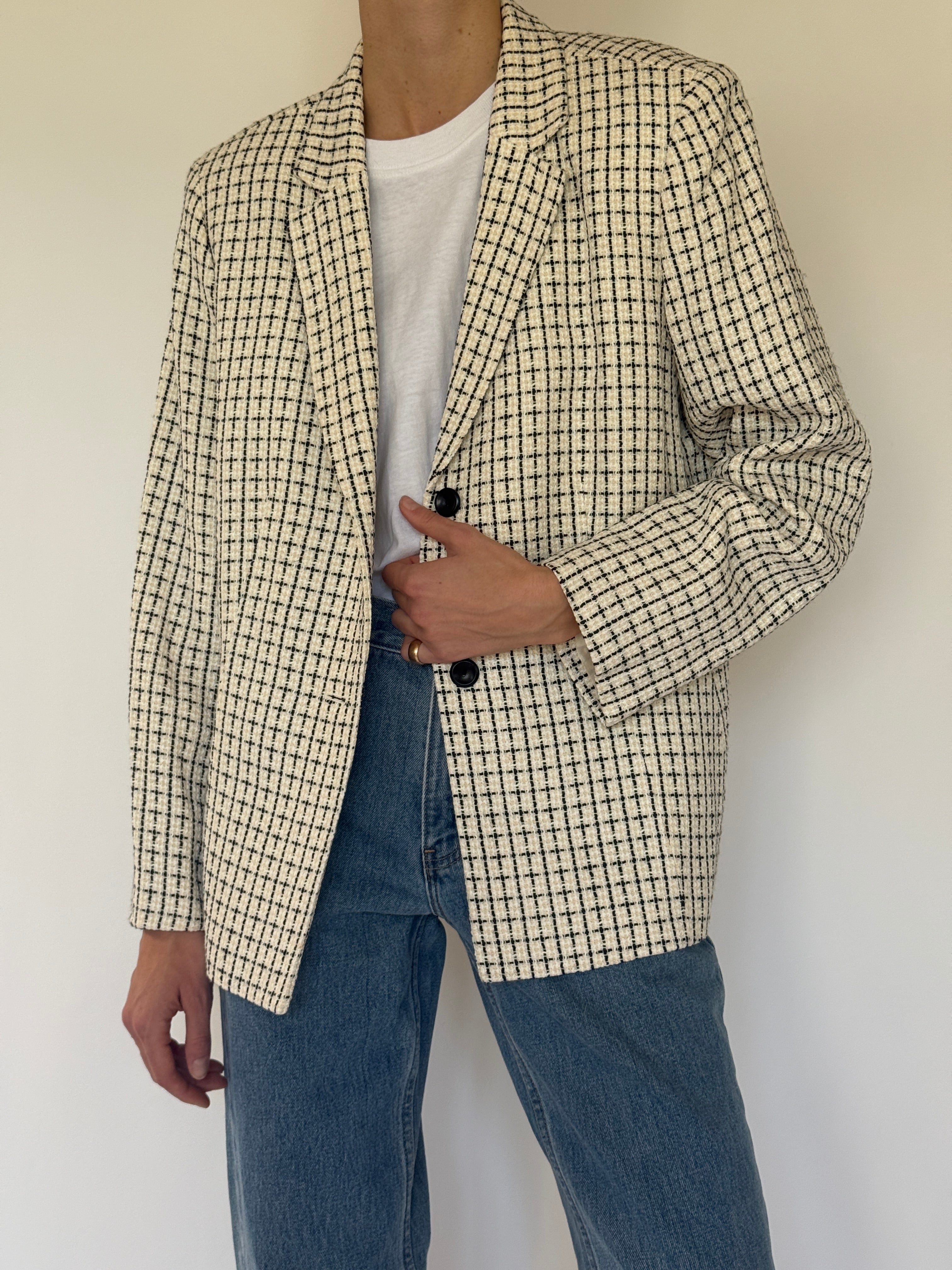 Vintage cream and black tweed blazer weave close-up