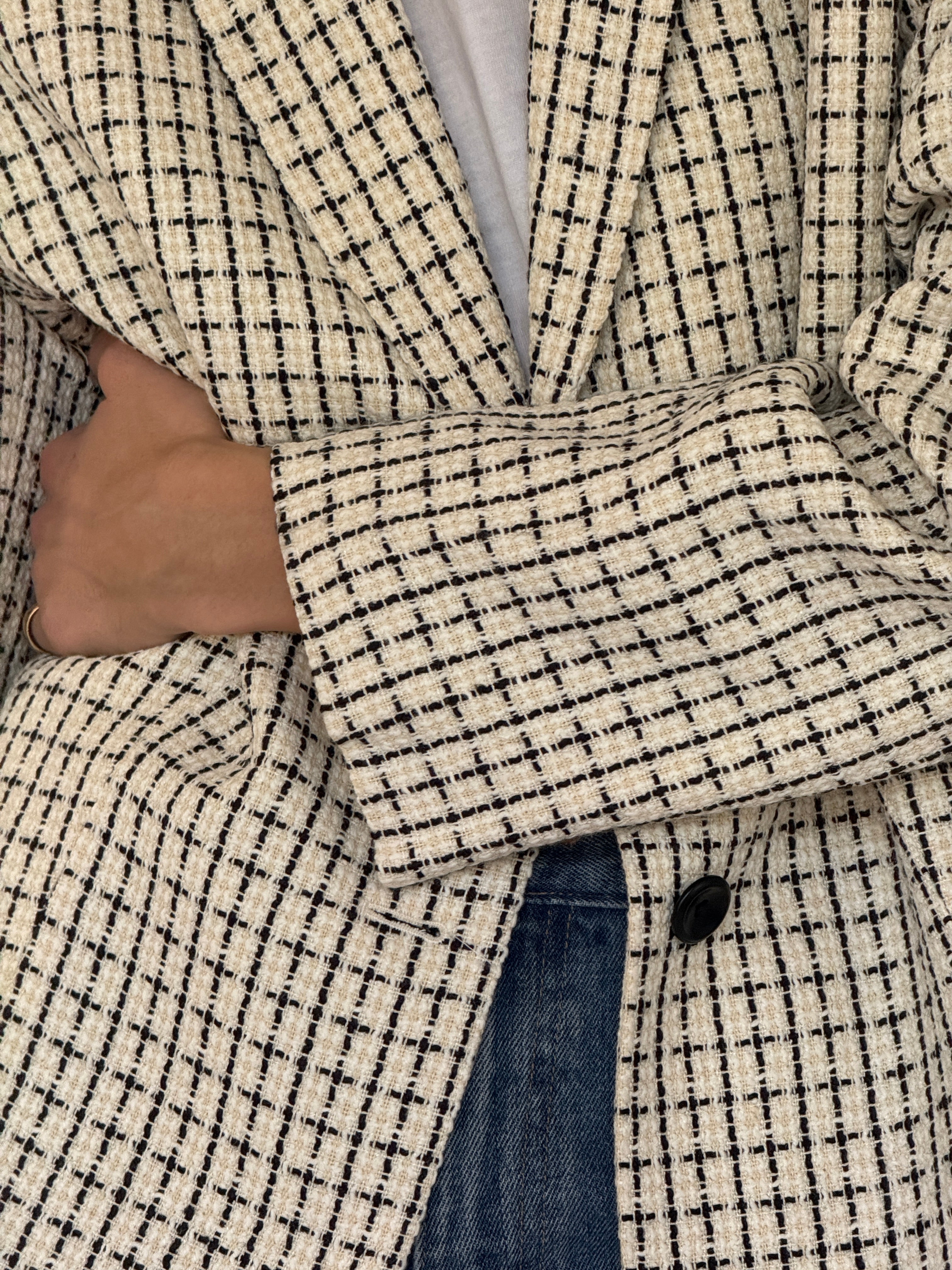 Vintage cream and black tweed blazer weave close-up