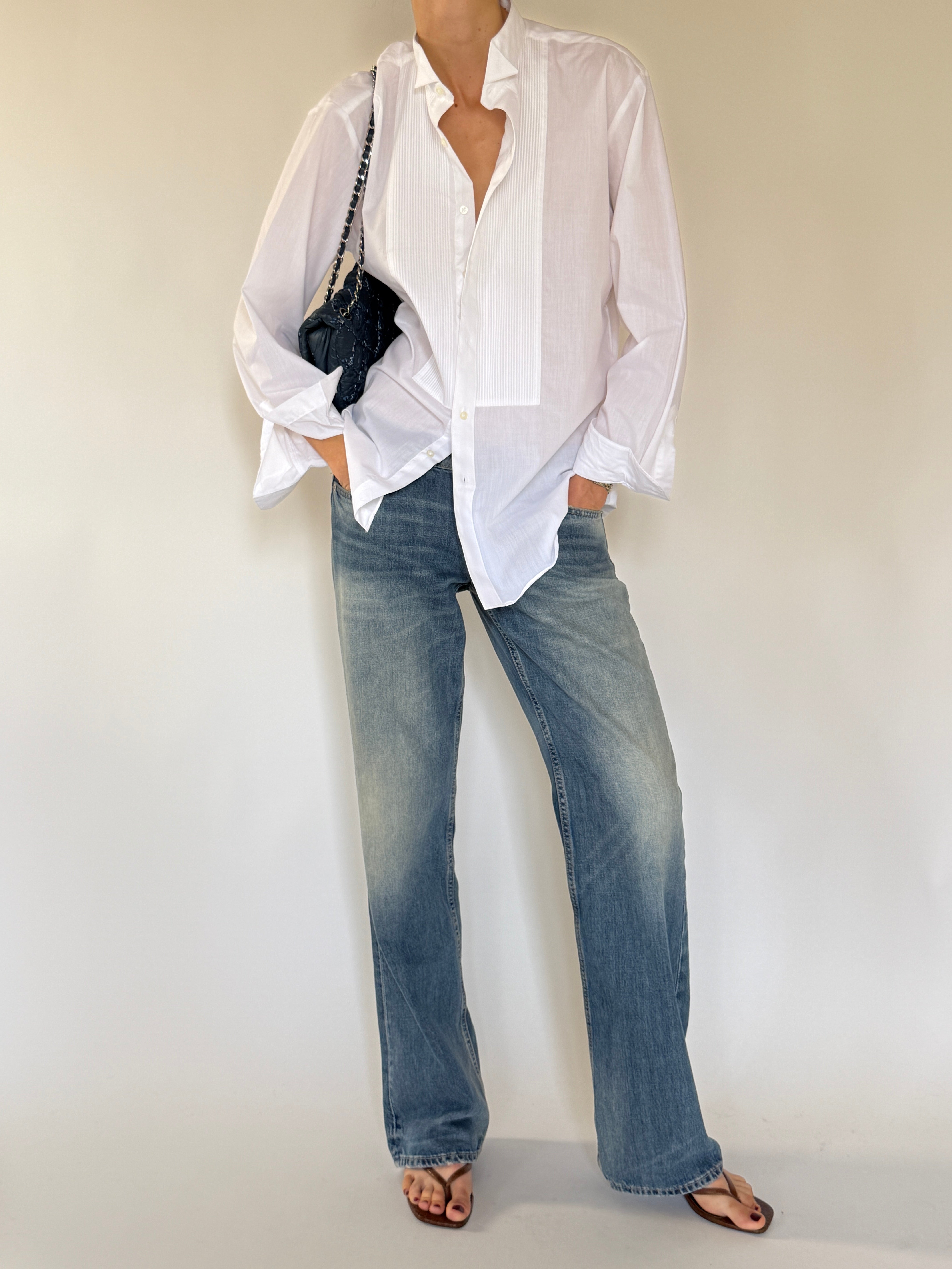 Vintage oversized white tuxedo shirt styled with denim