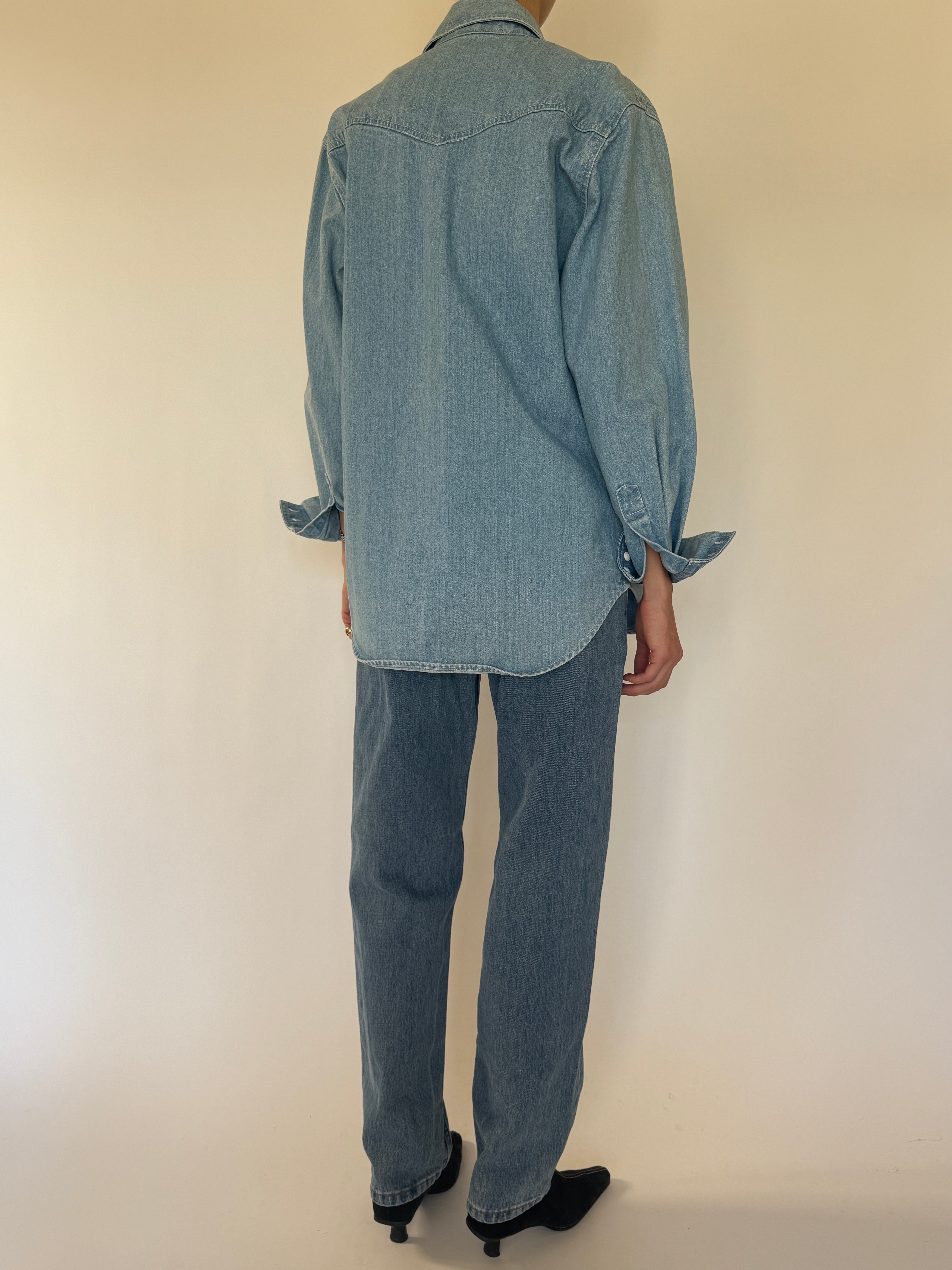 Vintage western-inspired blue denim shirt back view with western yoke