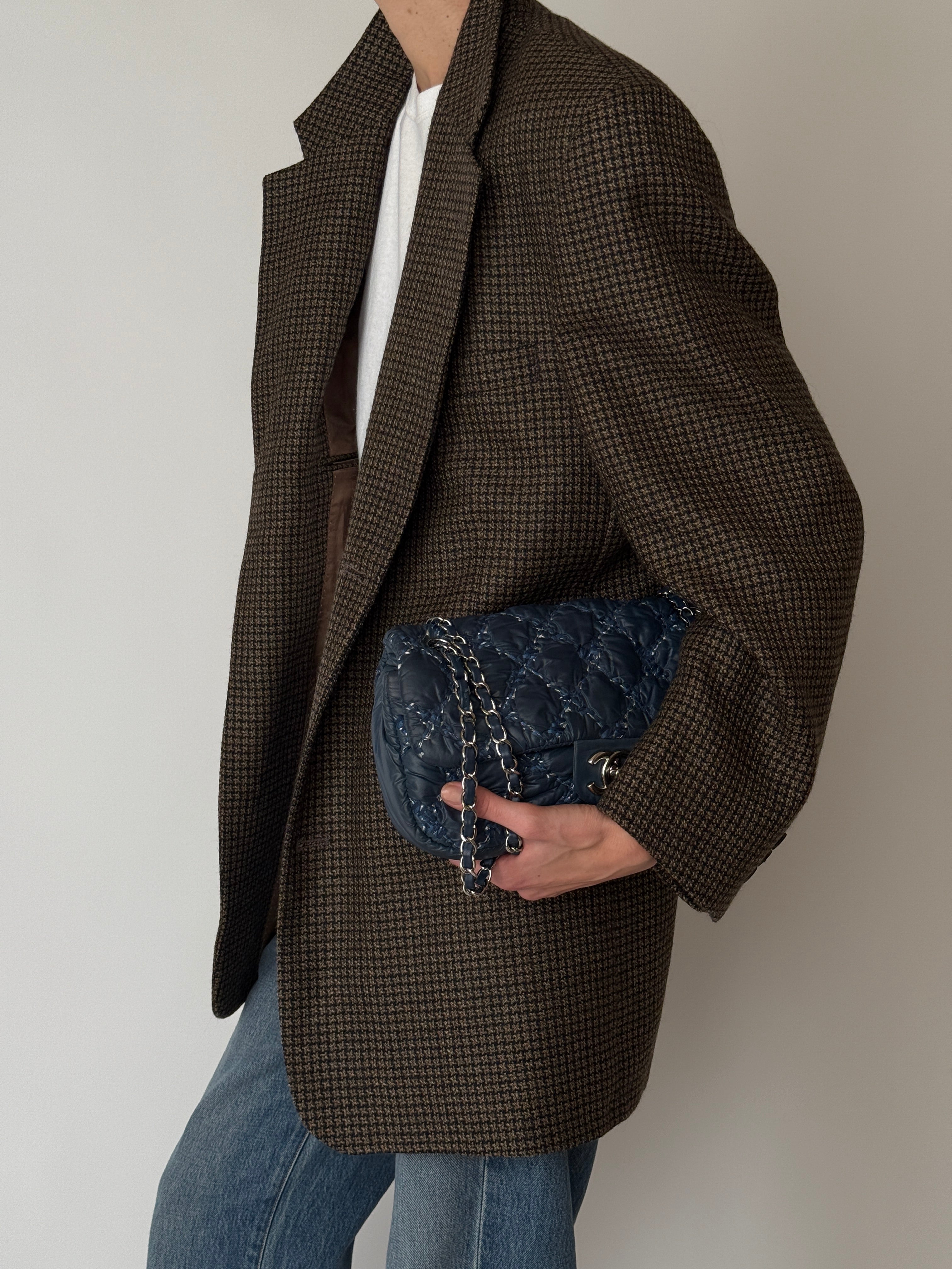 Brown houndstooth blazer shown from the side