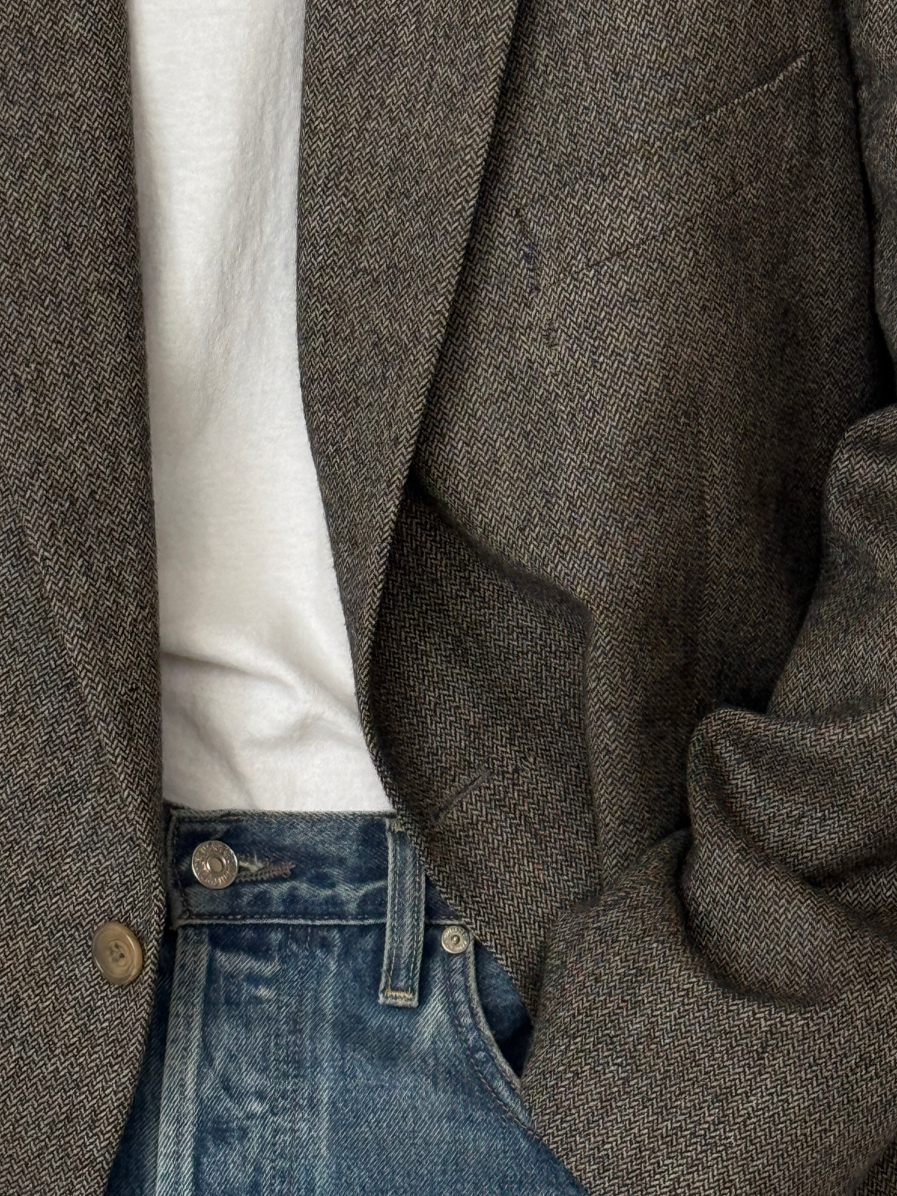 Vintage grey herringbone blazer fabric close-up