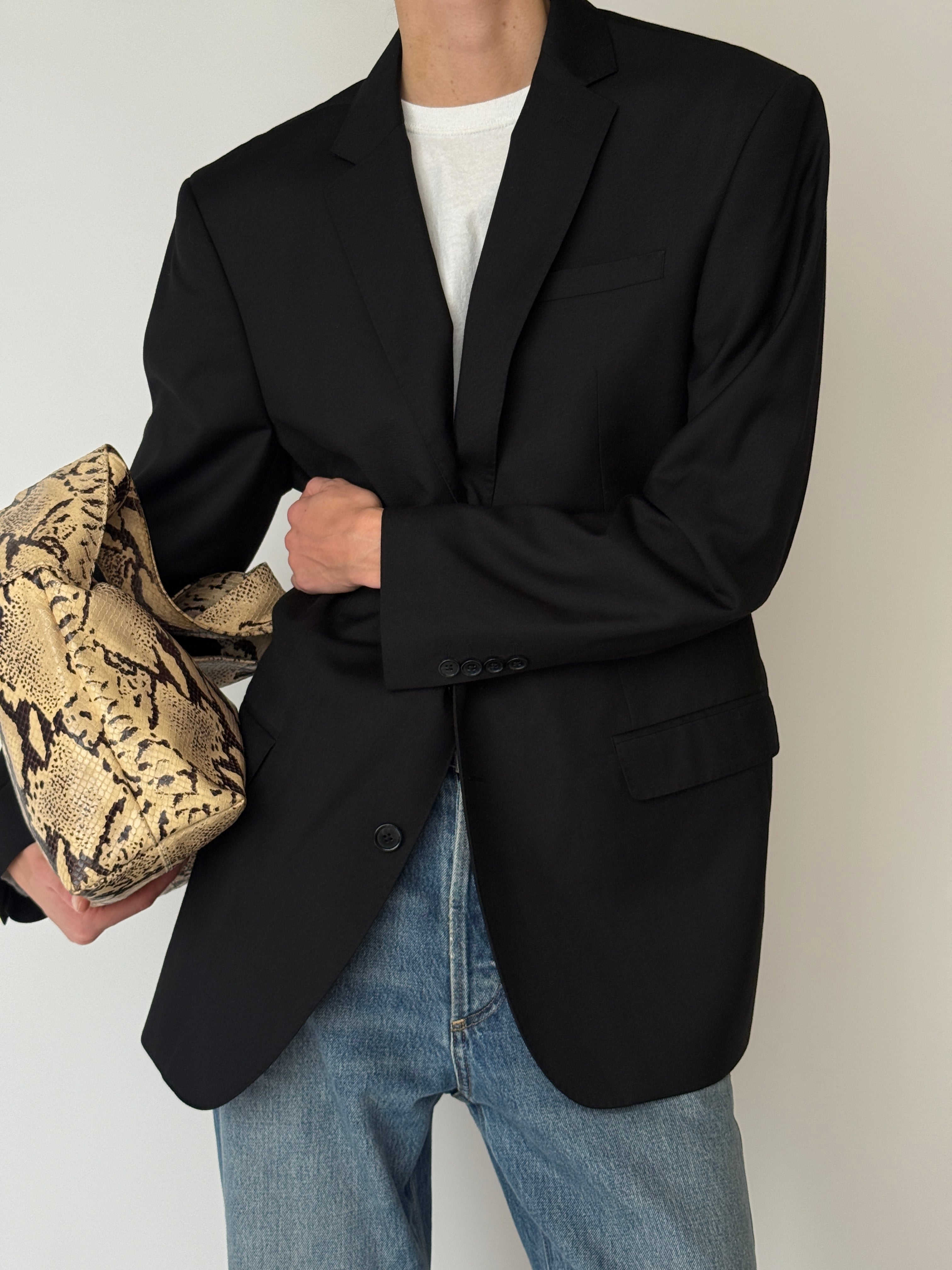 Vintage black blazer side view with clean tailored lines