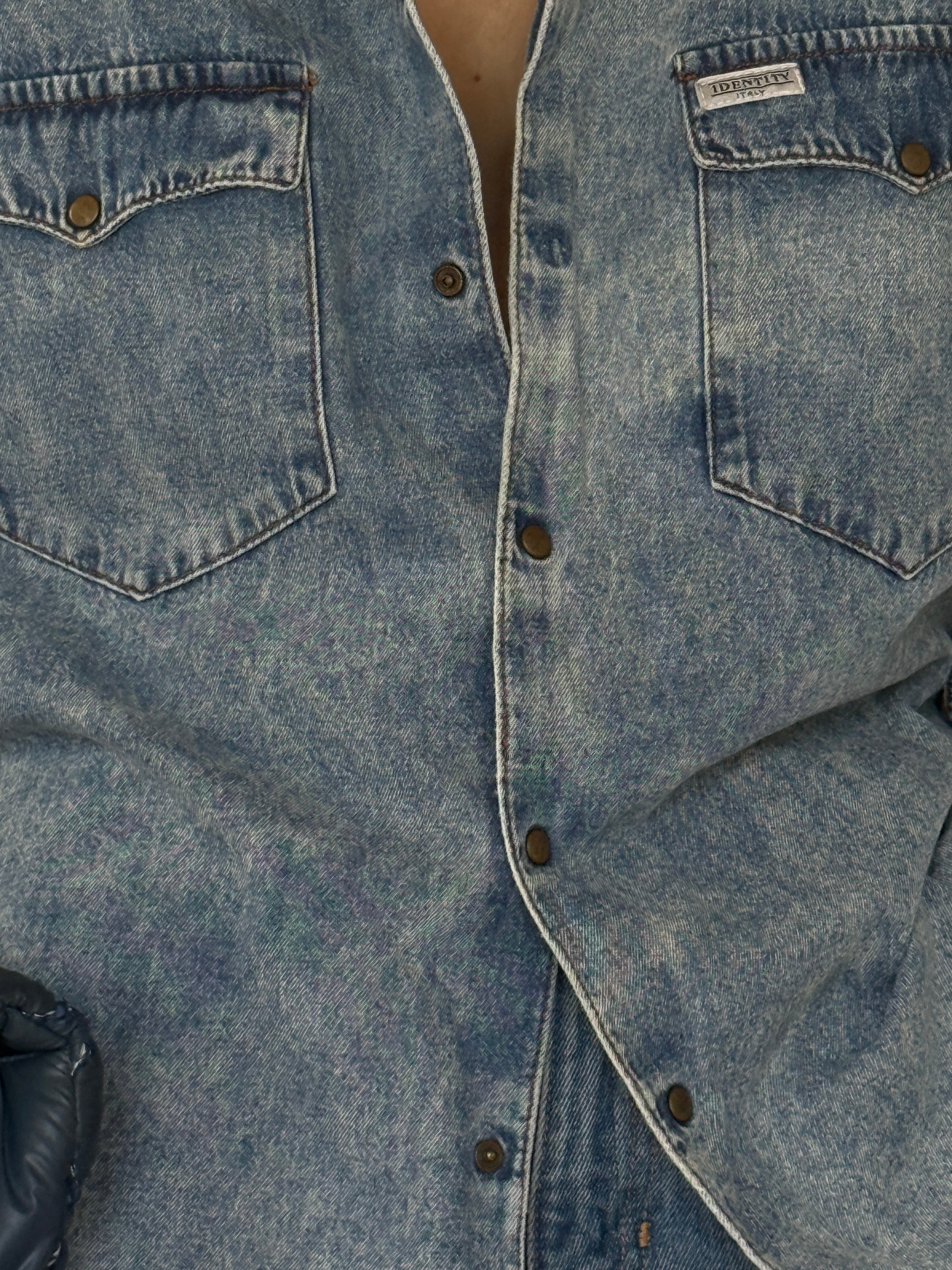 Vintage denim shirt faded blue fabric close-up