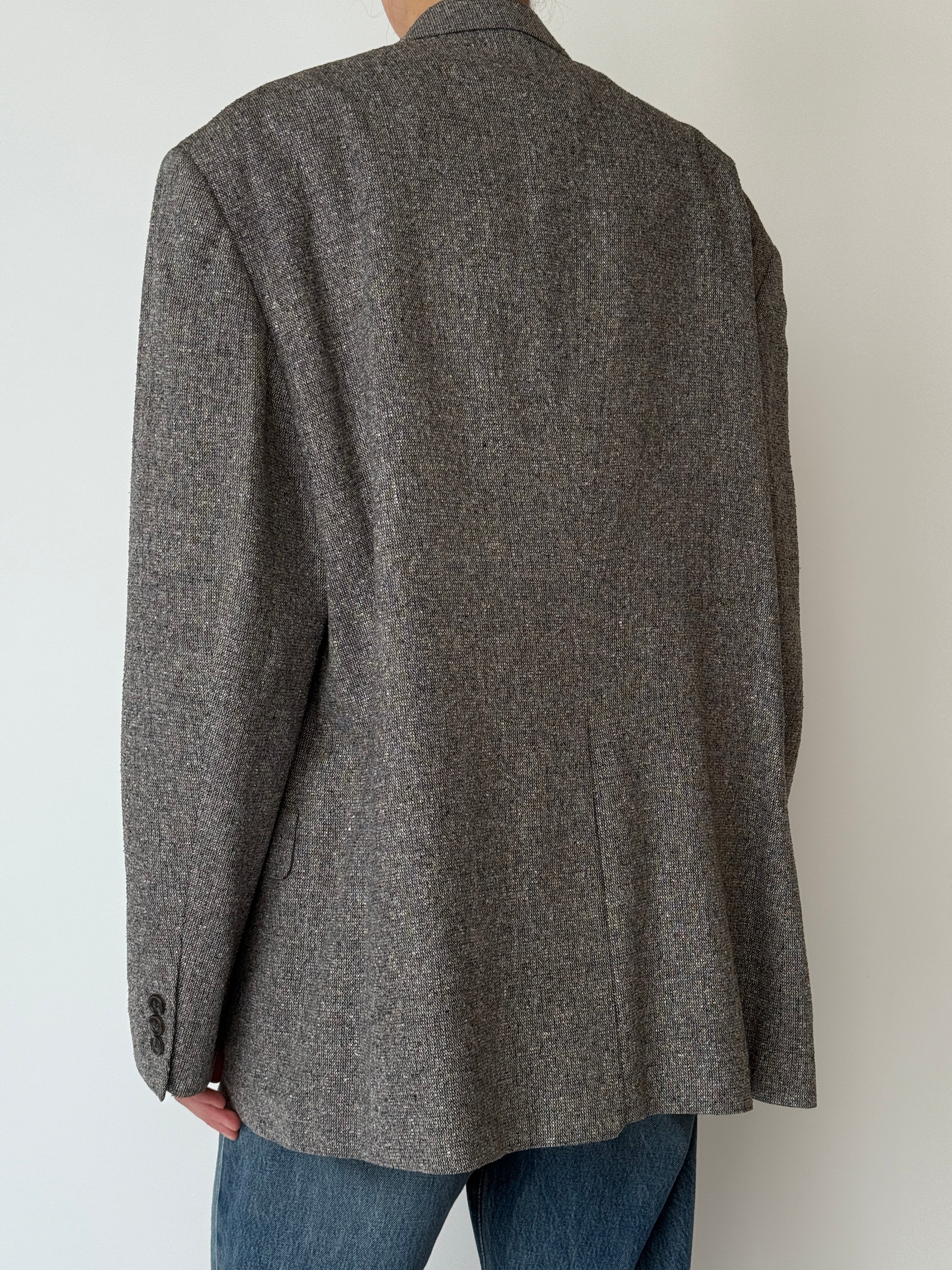 Vintage textured silk blazer with soft drape and tailored silhouette in grey back view