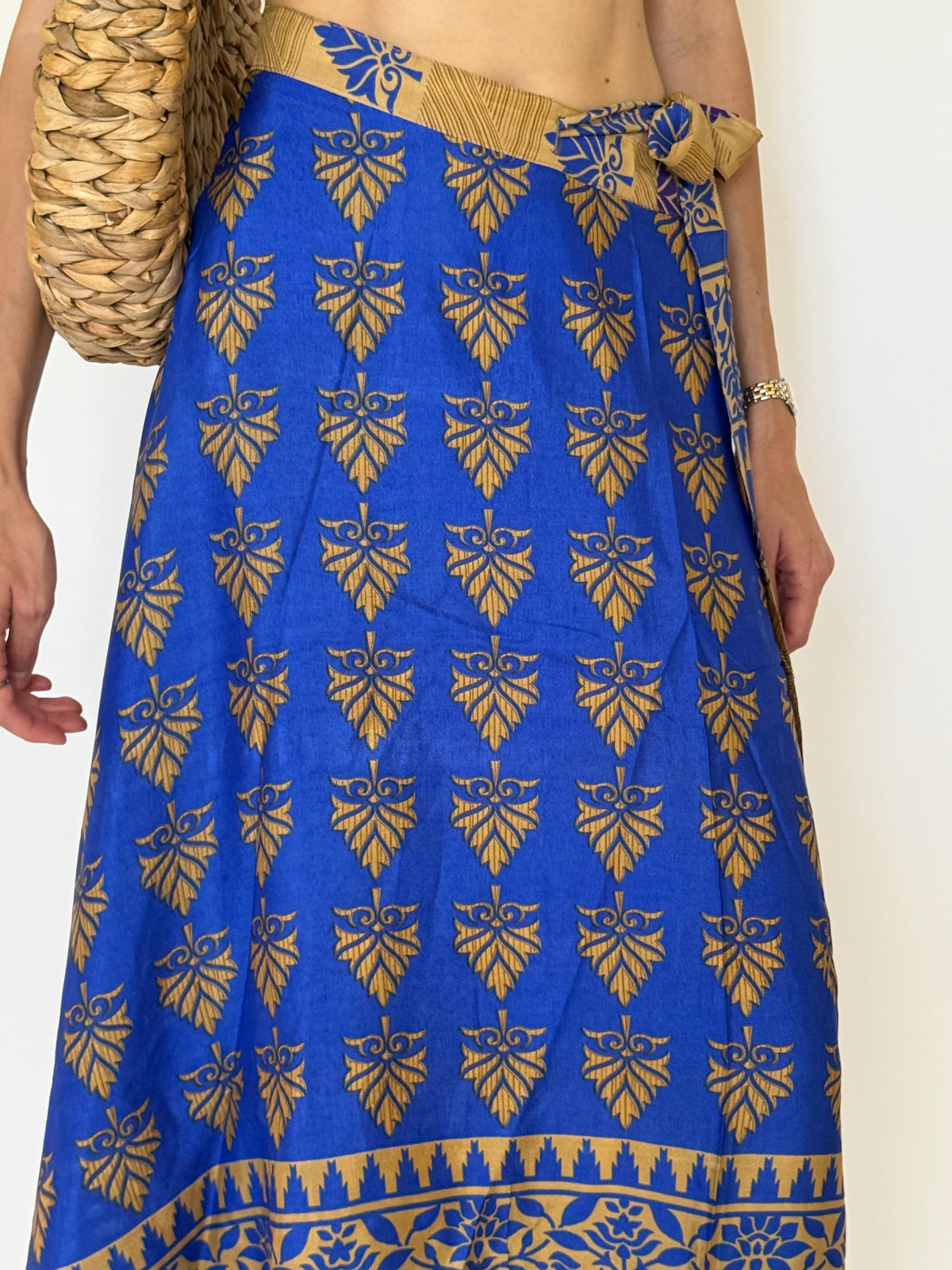 Vintage blue and gold print fabric close-up