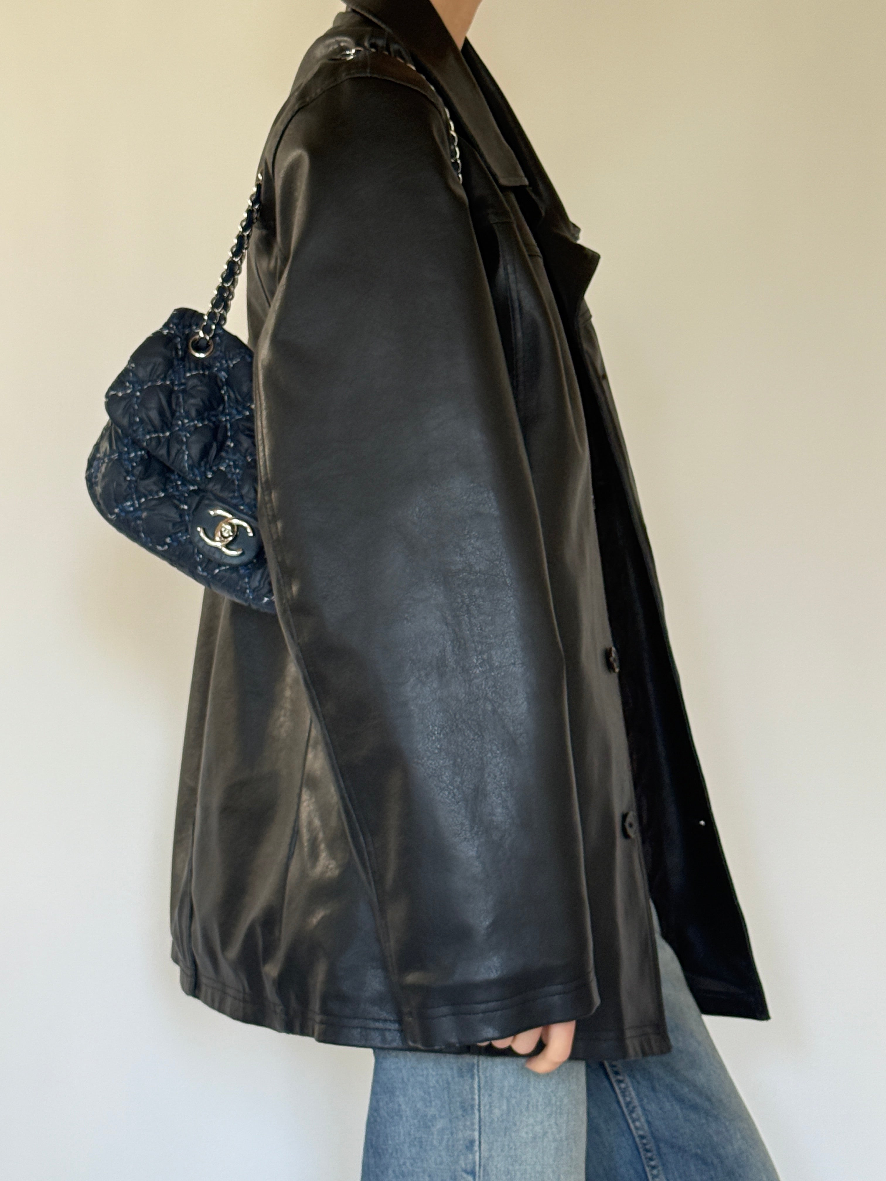 Vintage black leather jacket side profile view