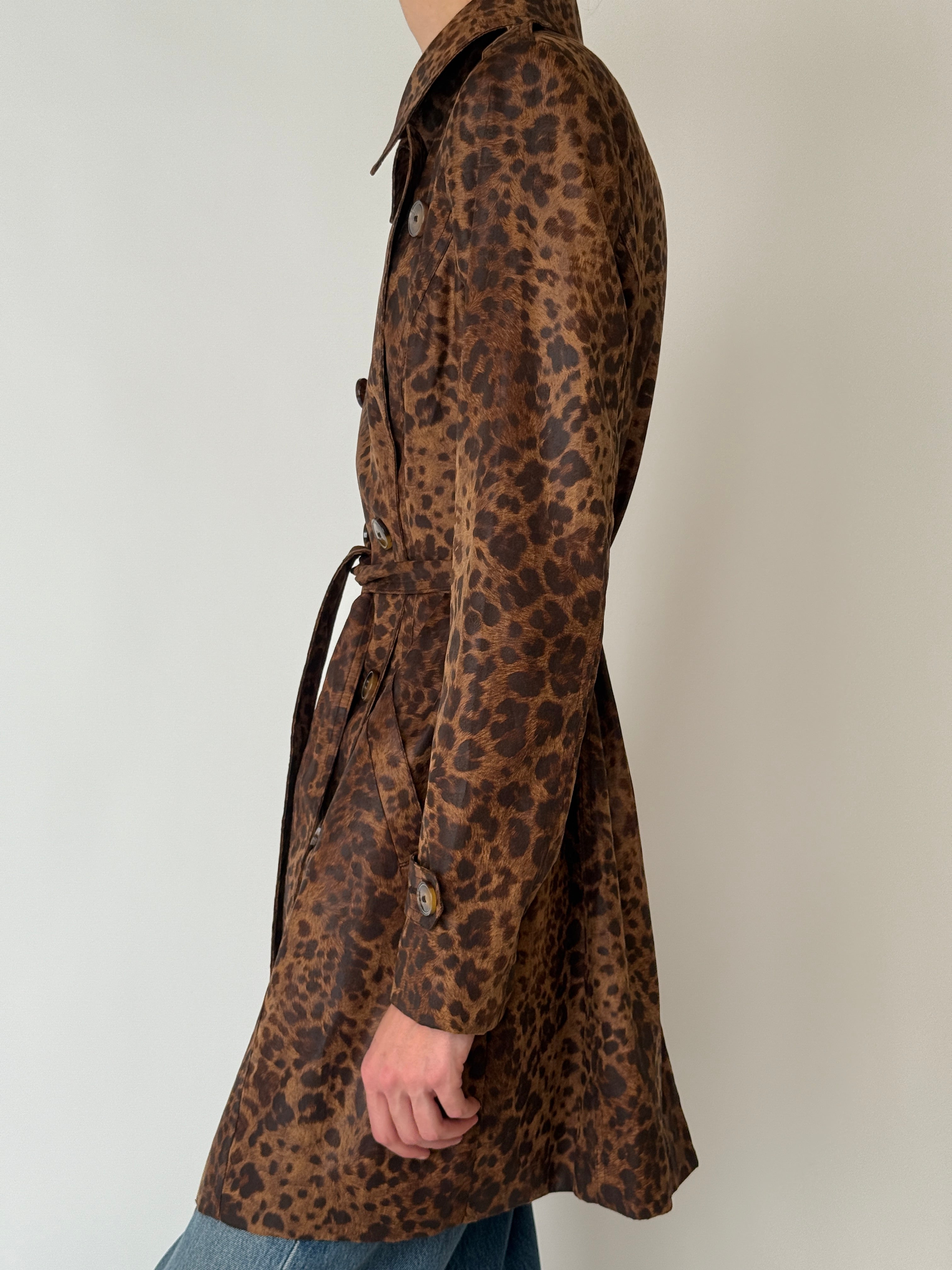 Close-up of vintage leopard print trench coat fabric texture