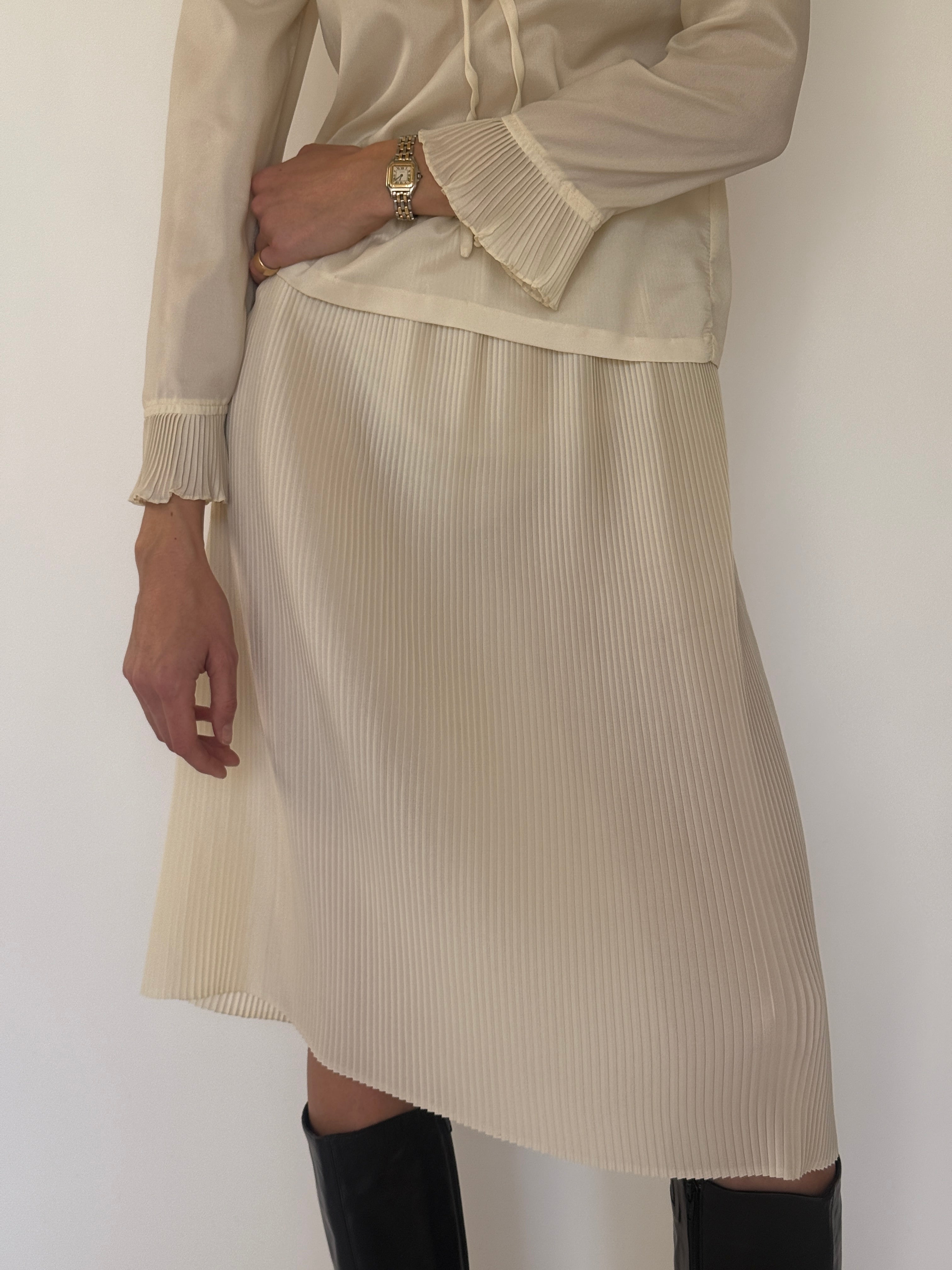 Vintage cream blouse and pleated skirt set fabric close-up