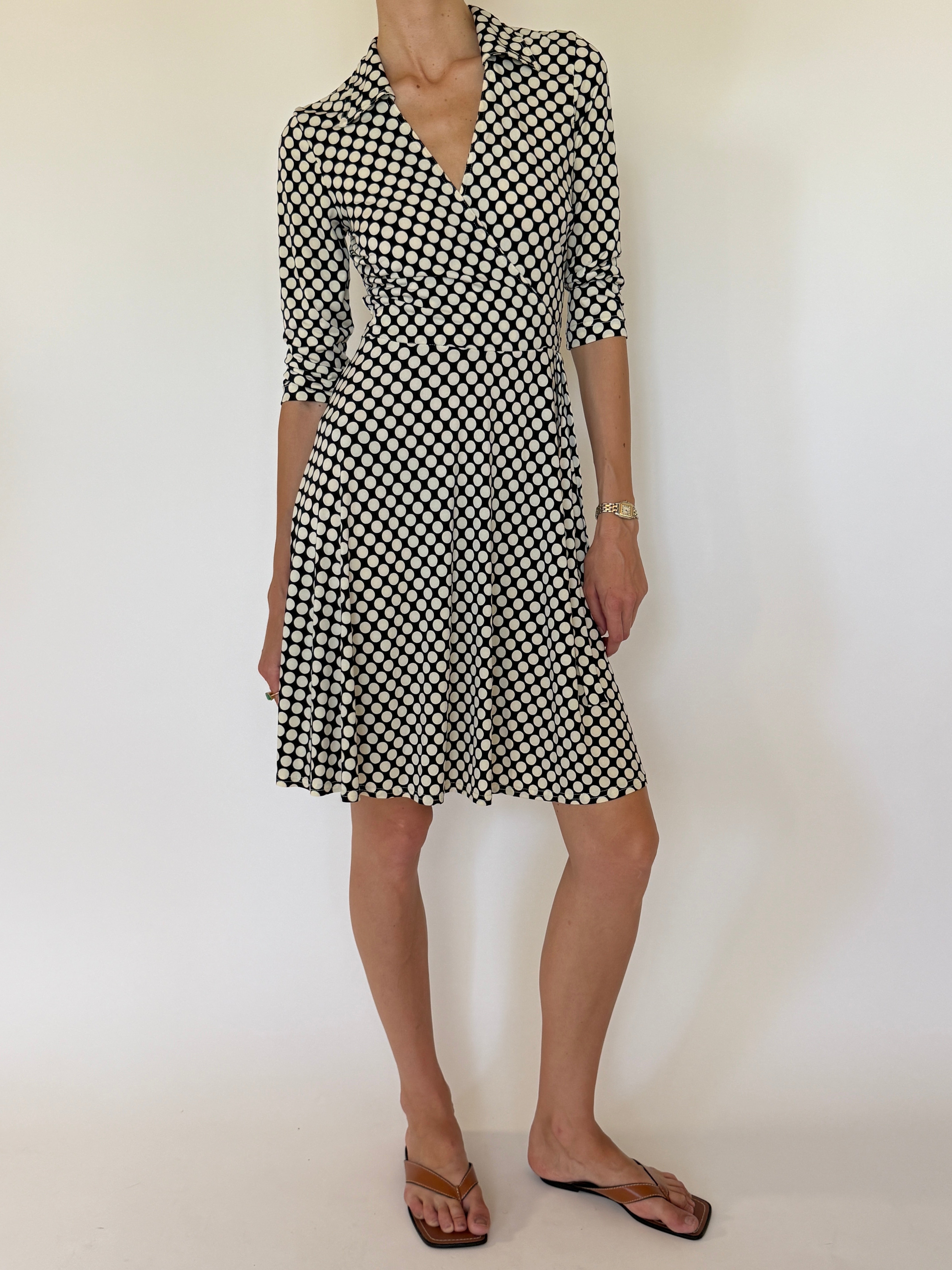 Vintage black polka dot wrap dress front view