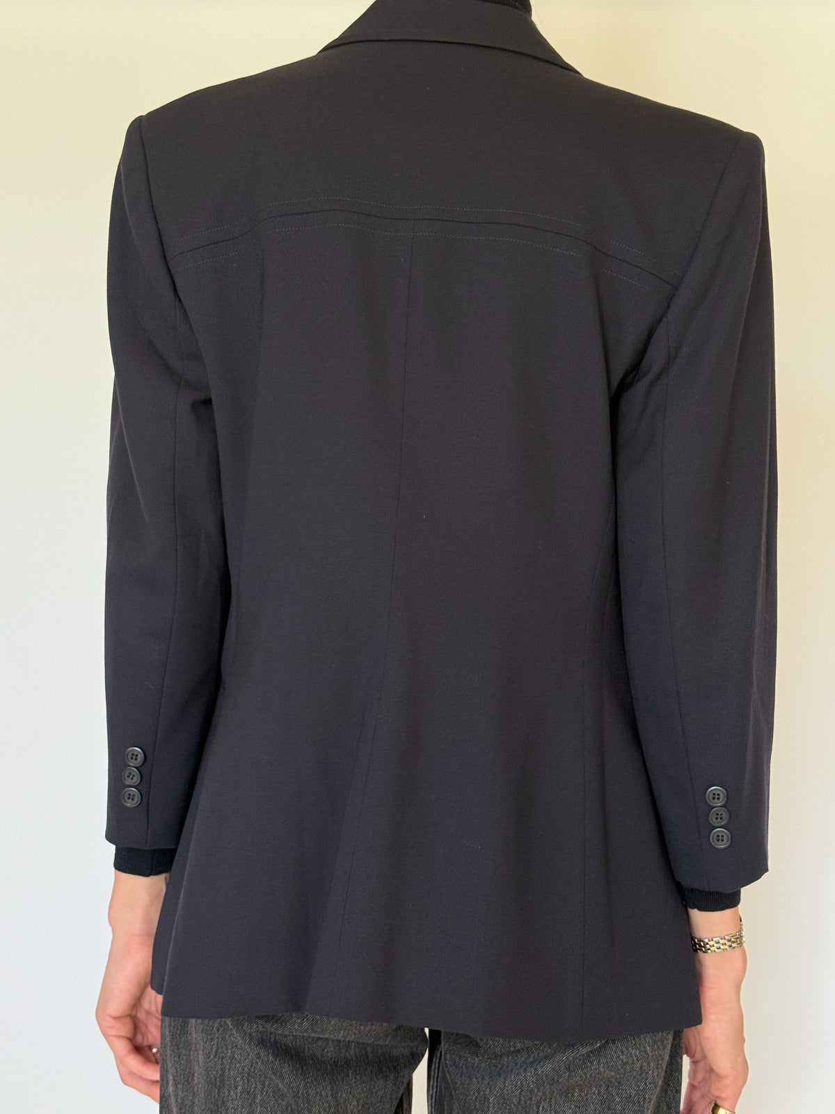 Back view of navy blazer and cuff buttons