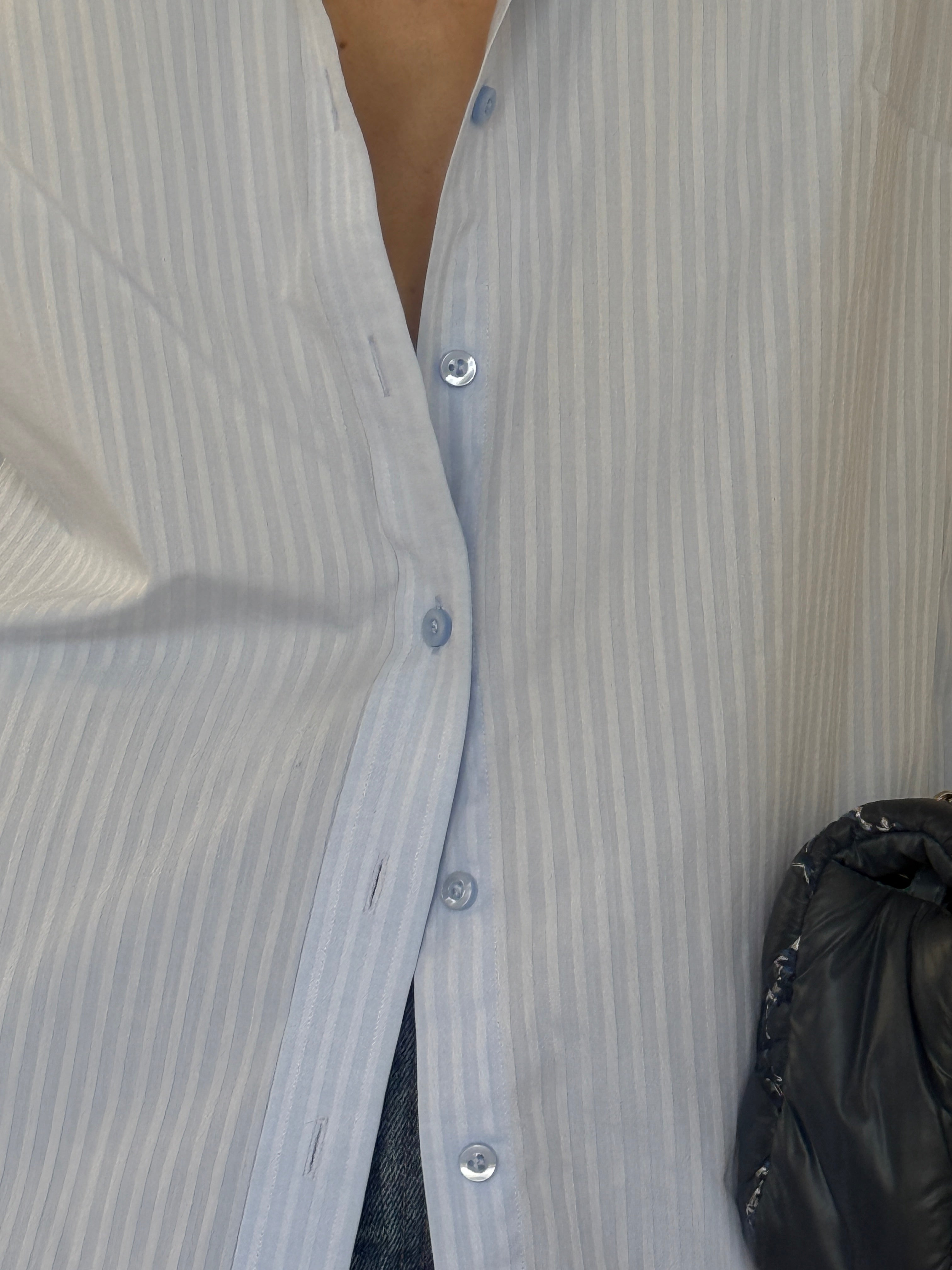 Vintage light blue striped shirt fabric close-up