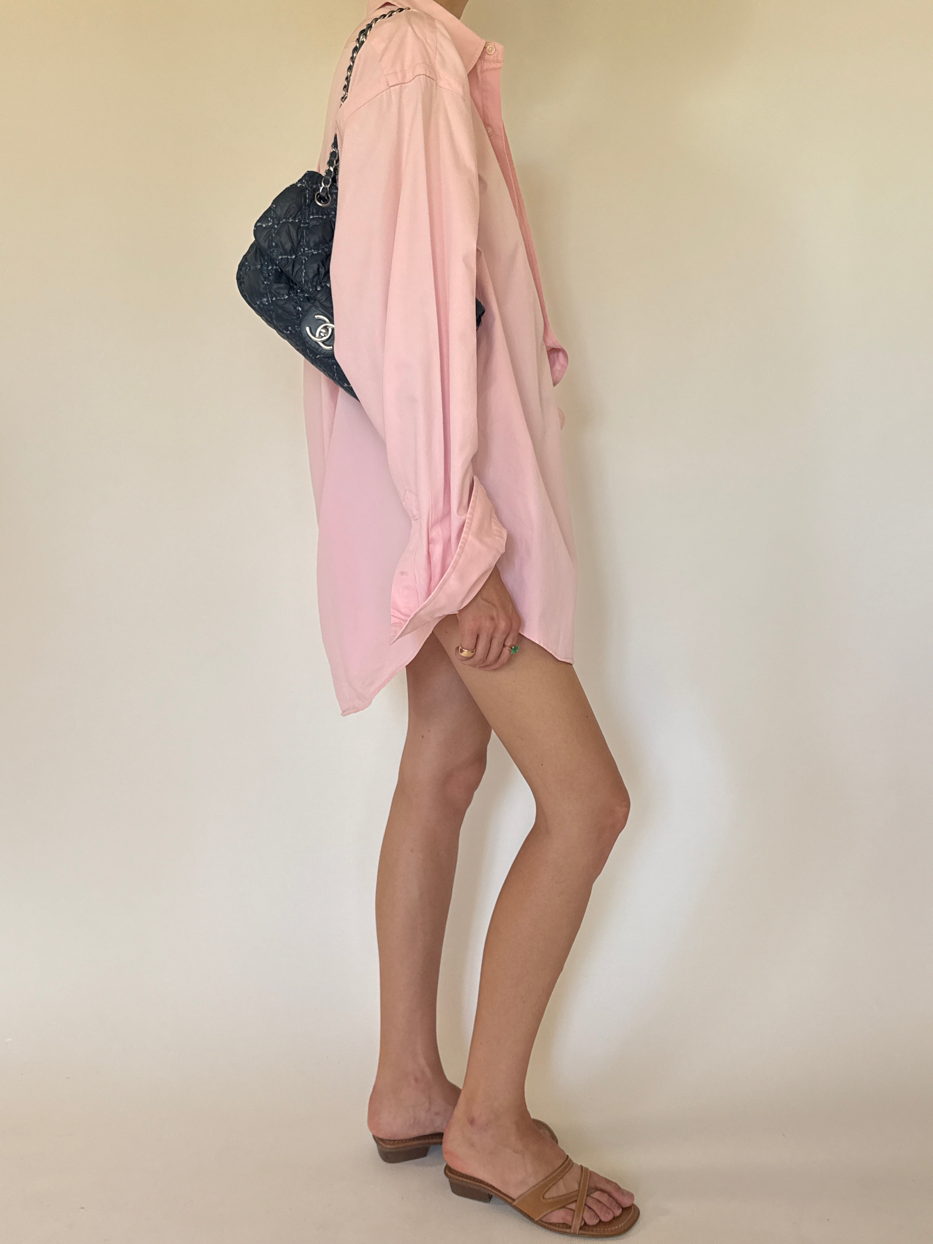Vintage Polo Ralph Lauren oversized pink button-up shirt side view.