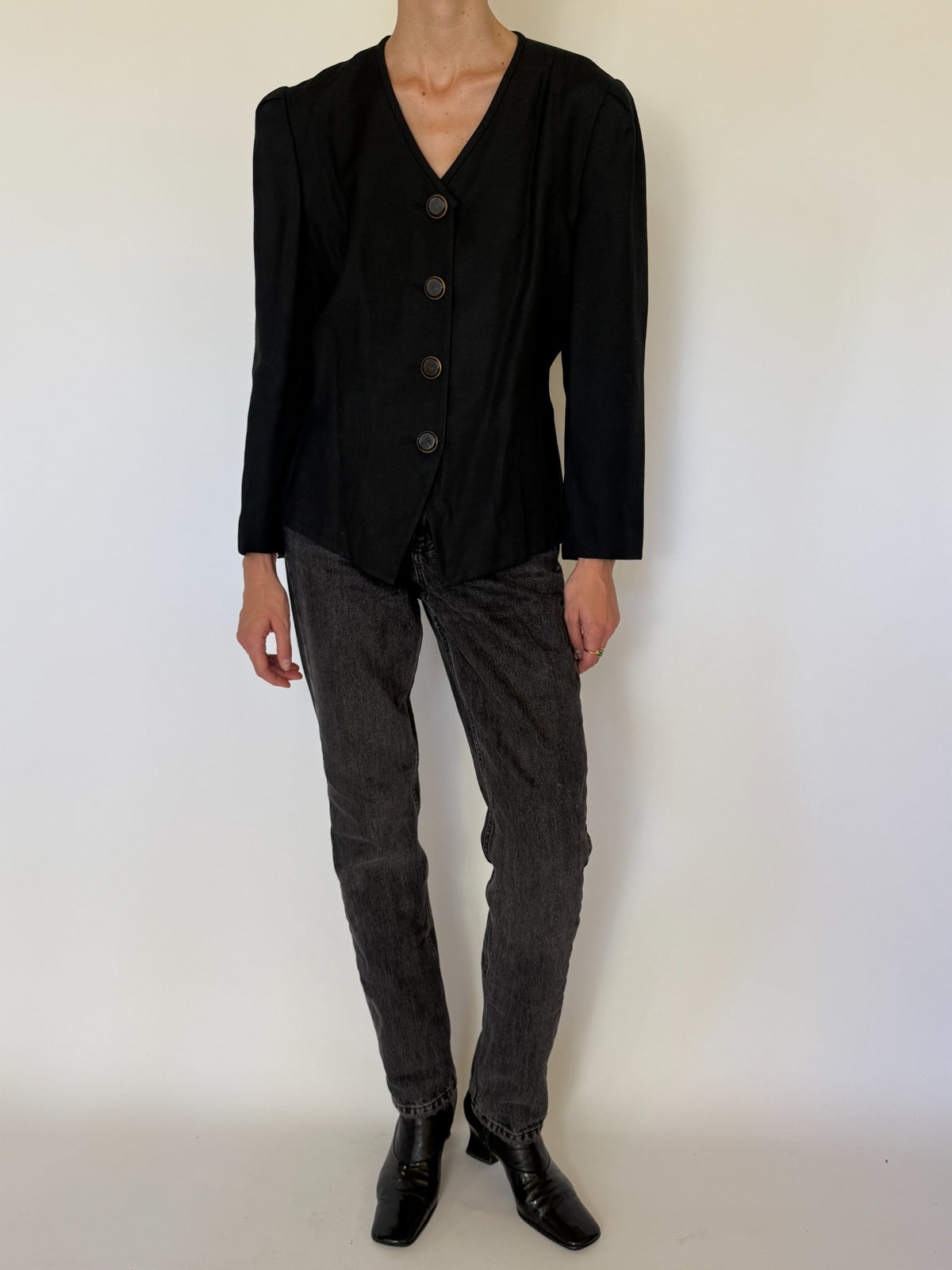 Front view of vintage tailored V-neck blazer in black