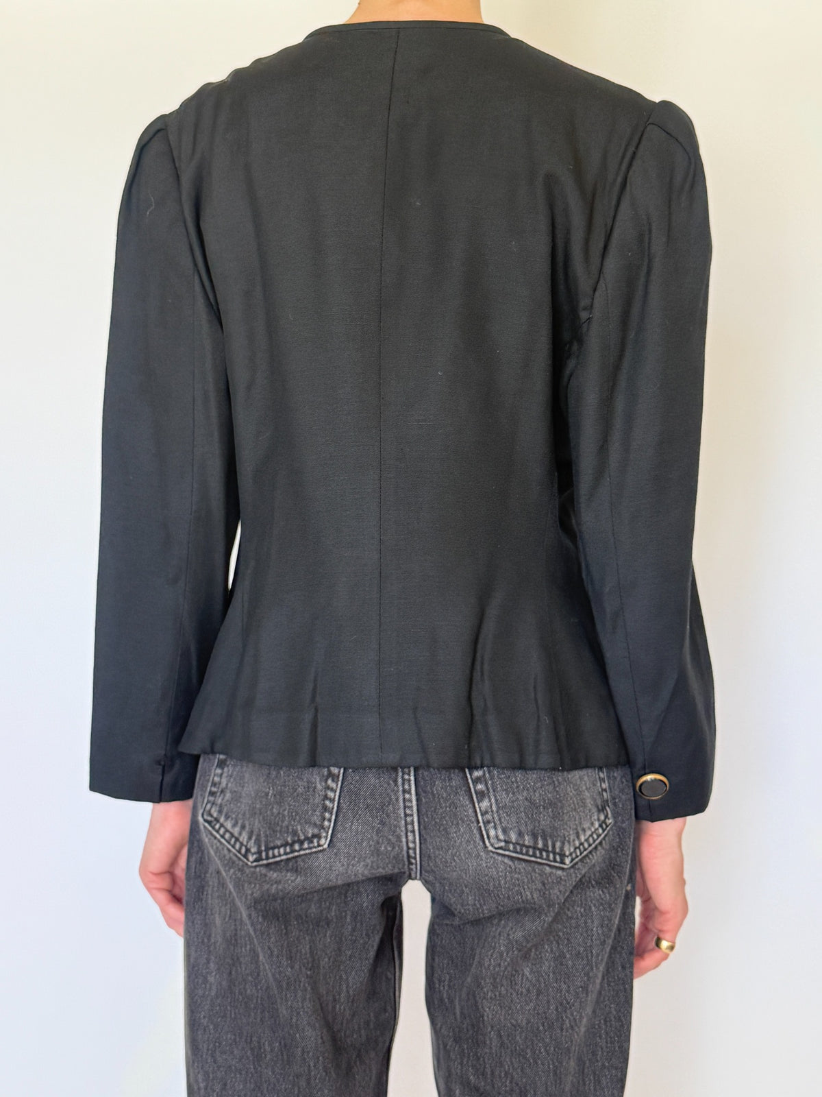 Close back view of black blazer