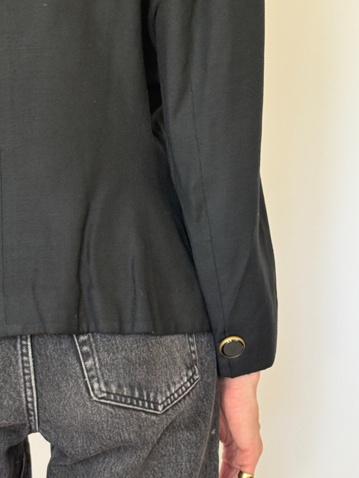 Close-up of gold-rimmed front buttons